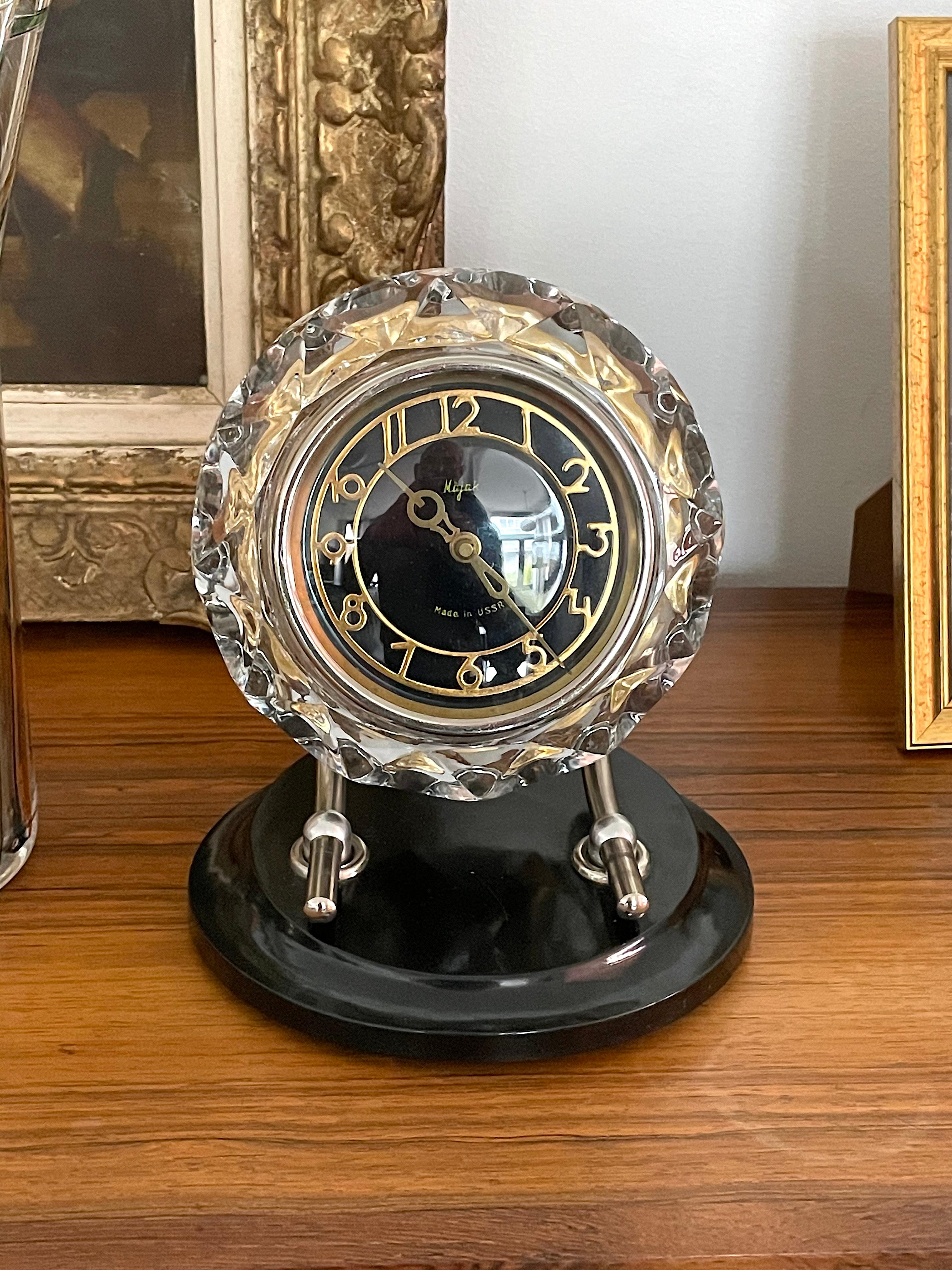 A great mechanical high-quality Mayak table clock in Art Deco style from the USSR 1950s-1970s period. Very original with its combination of glass, steel, and plastic. 
In near perfect condition. 
These were the favorite clocks of many officials