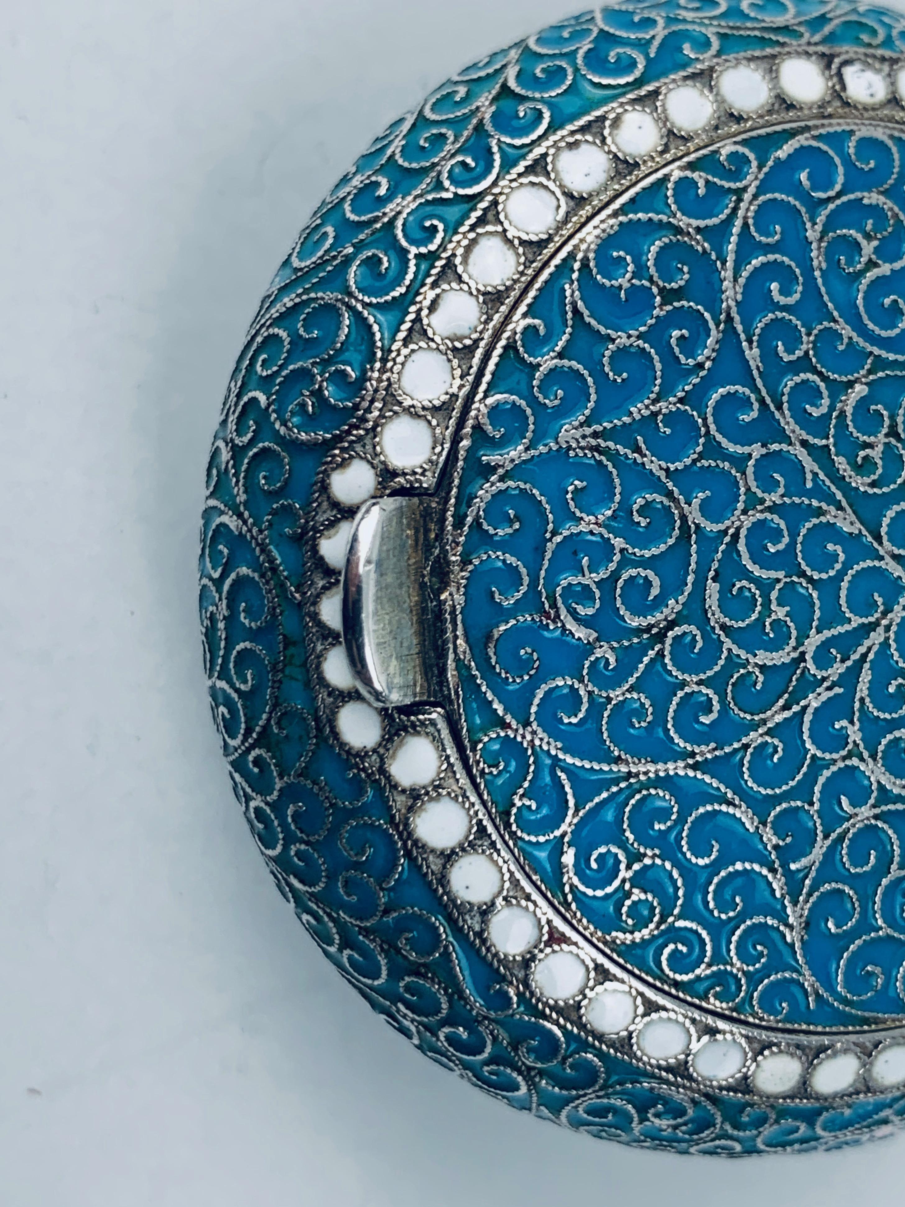 Russian enameled silver cushion shaped snuff box. The maker, Gustav Klingert, was the maker of this solid silver Imperial Russian snuff box with a parcel gilt interior. His design is of a filagree nature with silver cloisonné wires on a blue enamel