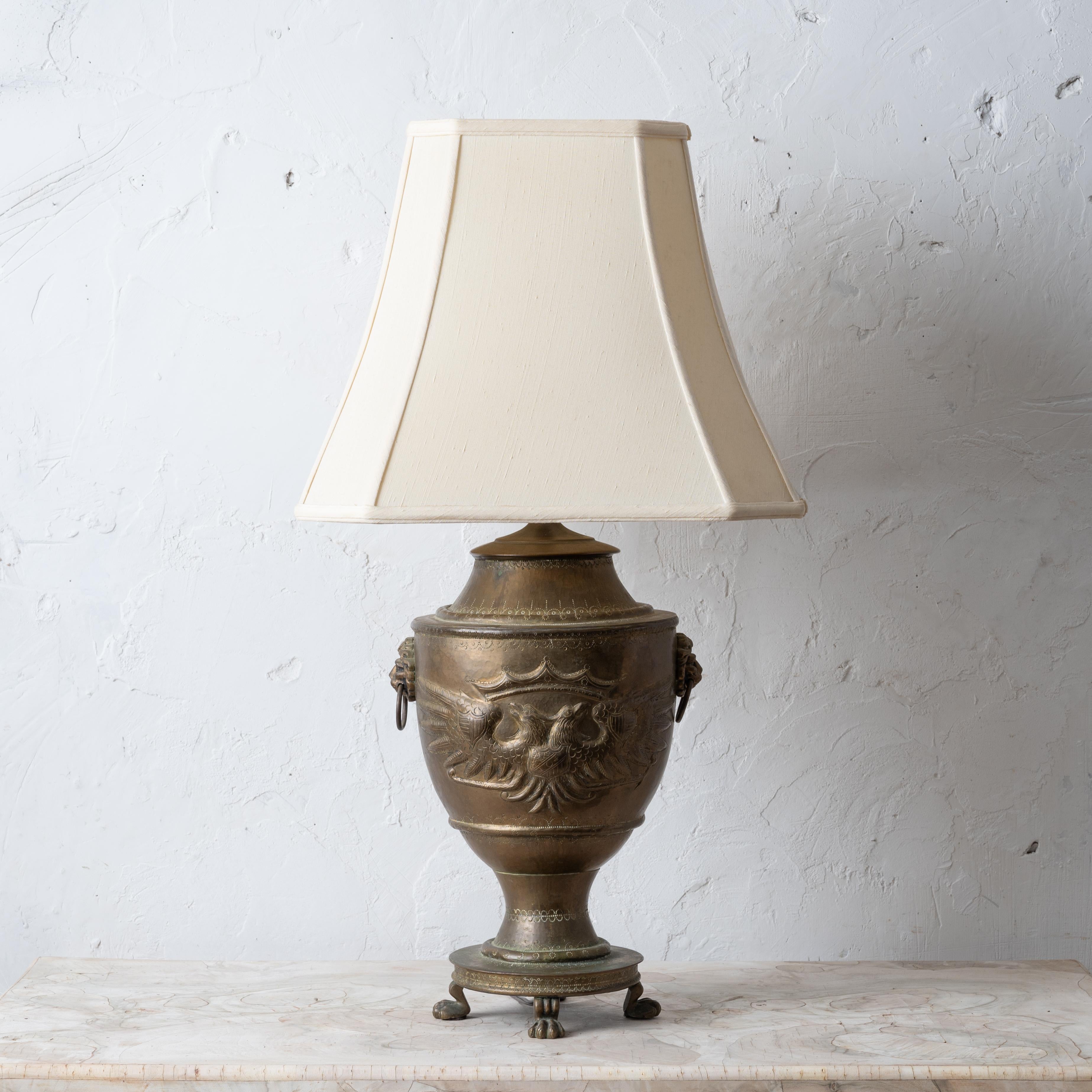 A Russian brass double-headed eagle lamp, mid-20th Century.


11 inches wide by 9 inches deep by 30 ¼ inches tall; 

shade measures 16 ½ inches wide by 13 ½ inches tall


(Let us know if not interested in shade.)