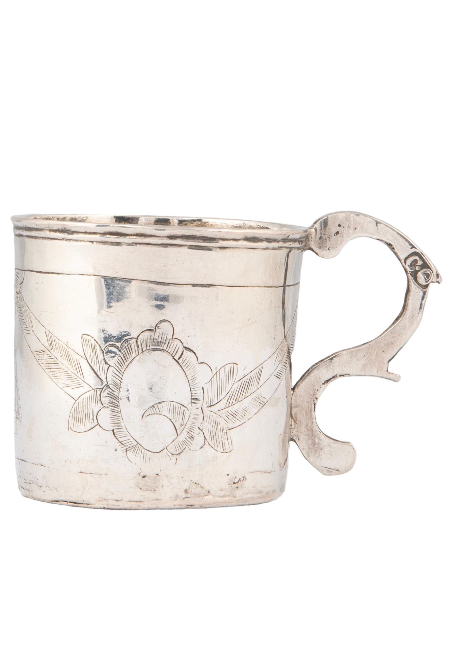 A rare treasure from the reign of Russian Empress Catherine the Great, this lovely 18th century silver charka or vodka cup was made in the ancient capital of Moscow.  Decorated with lightly engraved swags of ribbons and foliage typical of the period