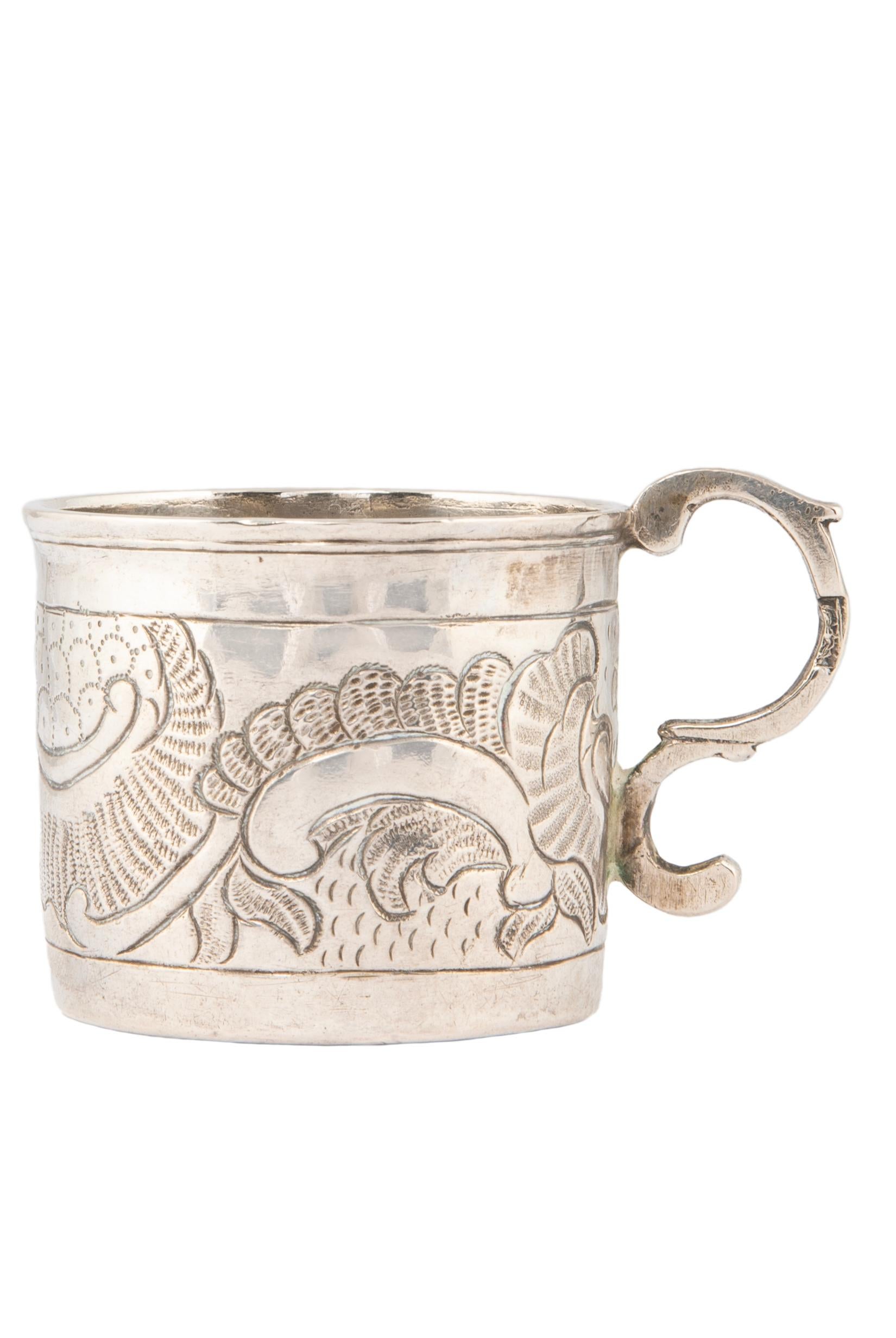 A rare treasure from the reign of Russian Empress Catherine the Great, this lovely 18th century silver charka or vodka cup was made by Grigorii Lakomkin in the ancient capital of Moscow.  Decorated with a repoussé rocaille design typical of the