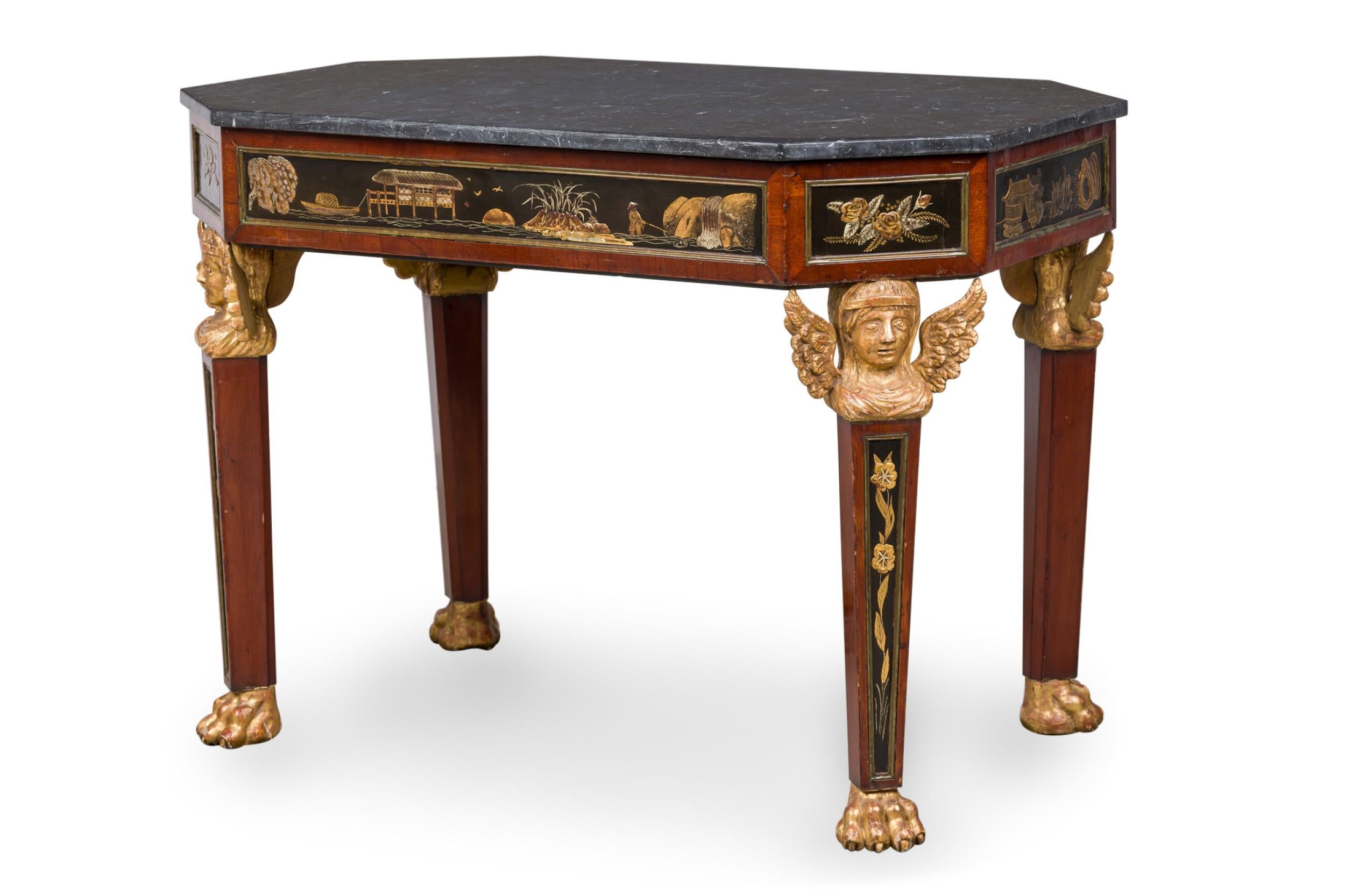 Possibly Russian (early 19th Century) mahogany center table with cantered corners and having a Chinoiserie gilt and lacquer decorated frieze supported on 4 tapered rectangular legs topped by winged Egyptian caryatid heads, resting on 4 lion\'s paw