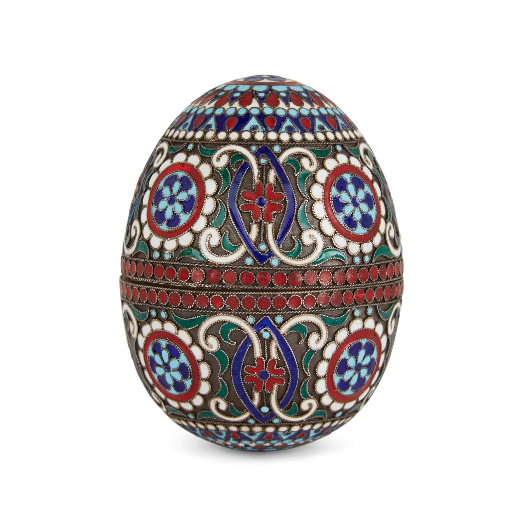Russian cloisonné enamel and silver gilt egg
Russian, 20th Century
Height 7cm, diameter 5cm

The complex technique of cloisonné enamelling is expertly employed on this delicate Russian egg. 

Decoration includes scrolling motifs, flowers, and bands