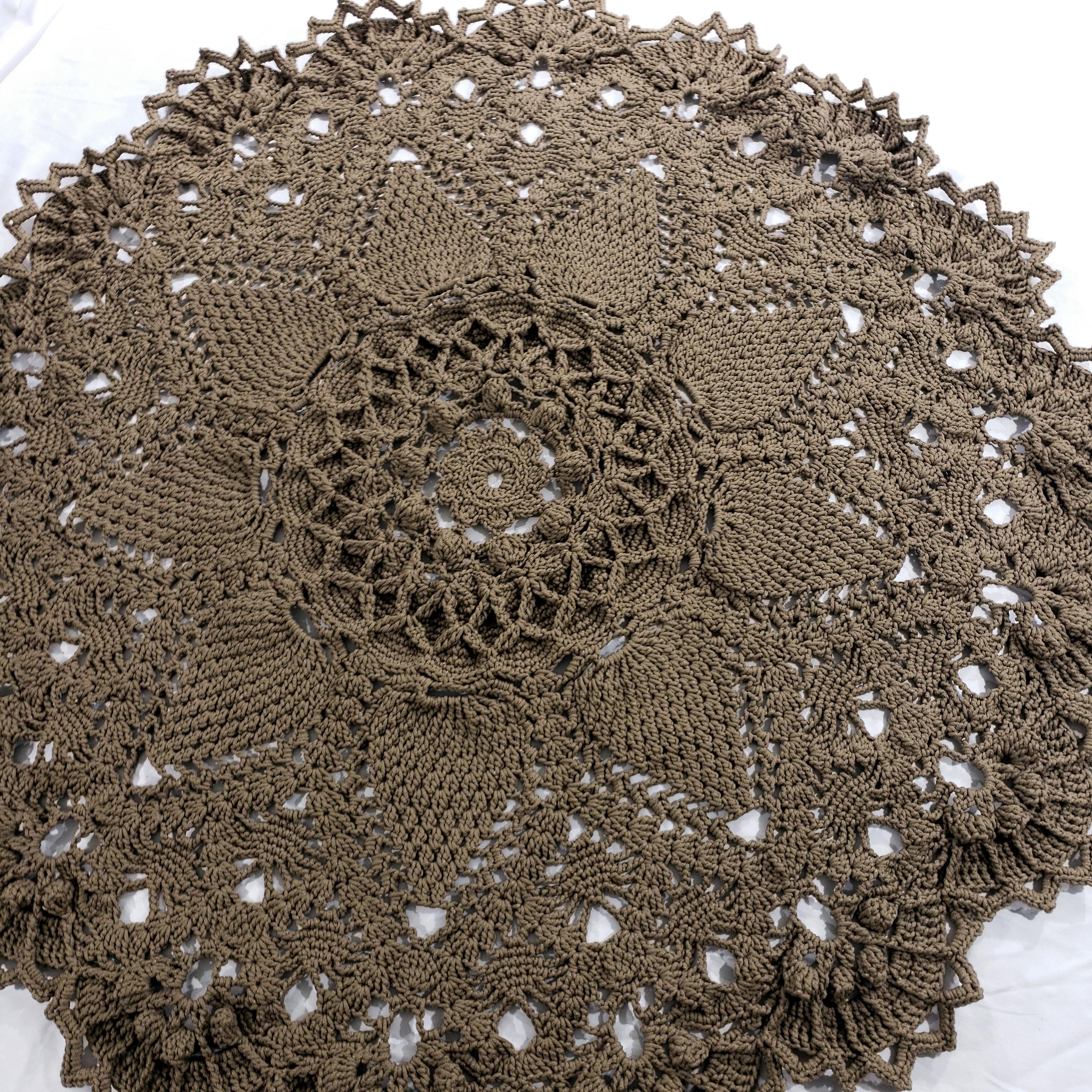 A crochet round rug with a traditional layered design, hand-made with classic Russian textile techniques. 
This luxurious modern rug with a vintage charm will add an elegant dimension to any room!

...

71 inches diameter
Hand made in
