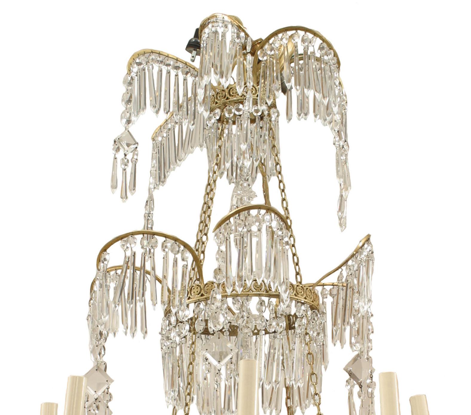 Russian (1st Quarter 19th Century) crystal & gilt bronze chandelier with 8 swirl design arms with lights emanating from a ring base below 2 smaller rings with swirl extensions
