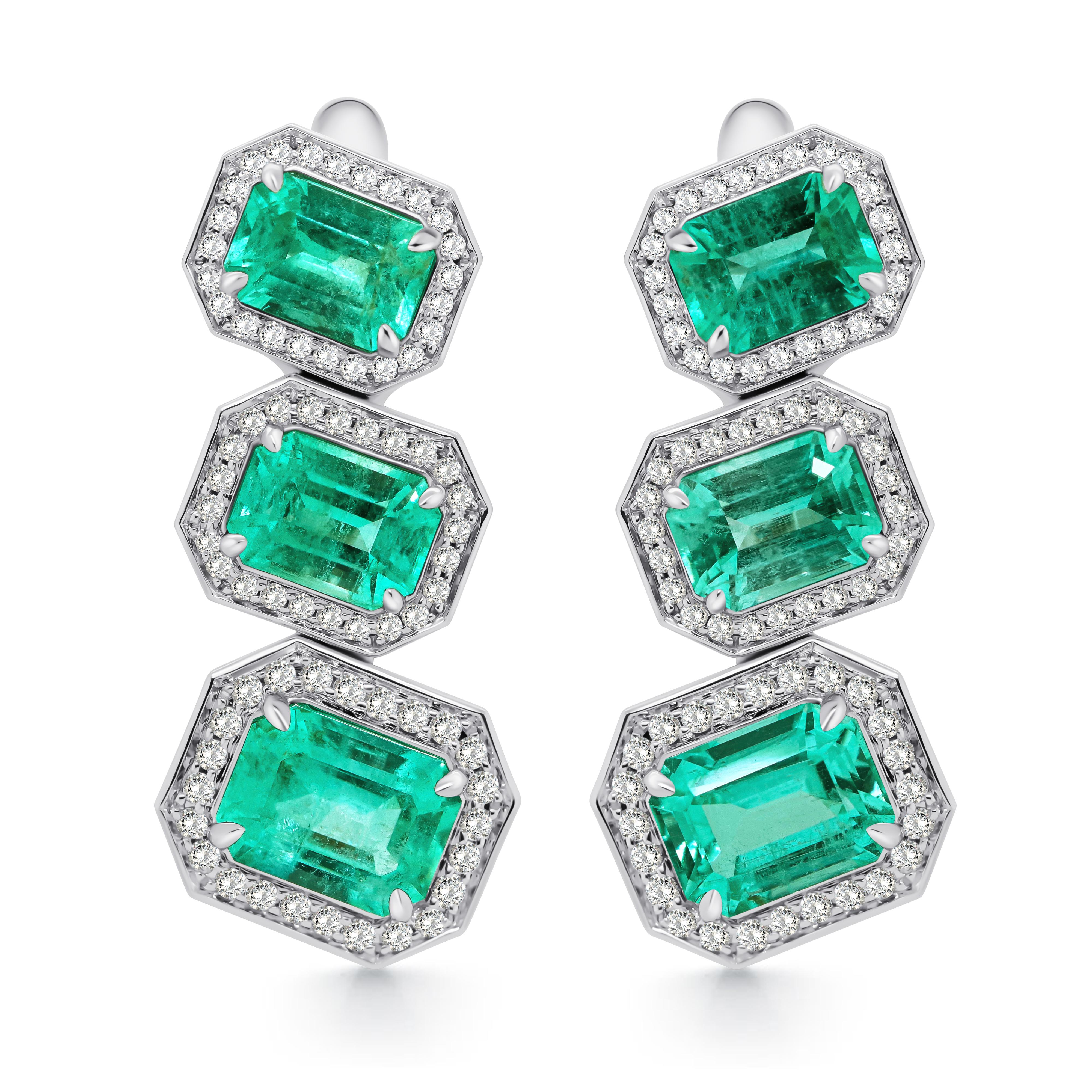 The rich beauty of Emerald is enclosed in every reflection.

Centered by six perfectly matched green Russian Emeralds totaling 6.42 Carats, accented by 144 Round-Brilliant Cut Diamonds, and set in lush 18K White Gold. These stunning earrings are a