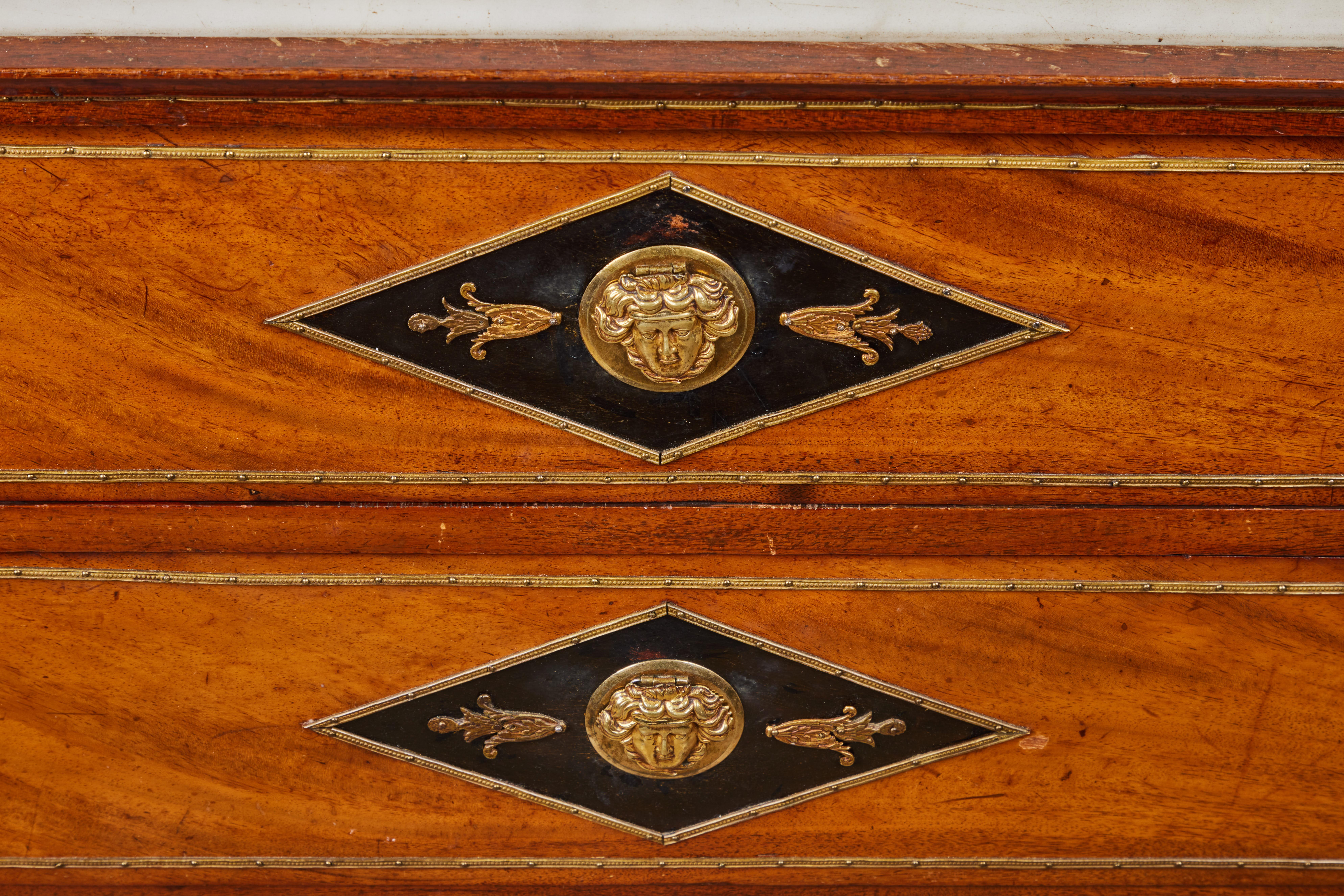 An exceptional Russian Empire fruitwood and ebonized 4 drawer chest/secretary. The top drawer conceals the drop-down desk featuring 6 drawers and a lapis lazuli, marble and brass plaque depicting a mythological scene. Locks are concealed under brass