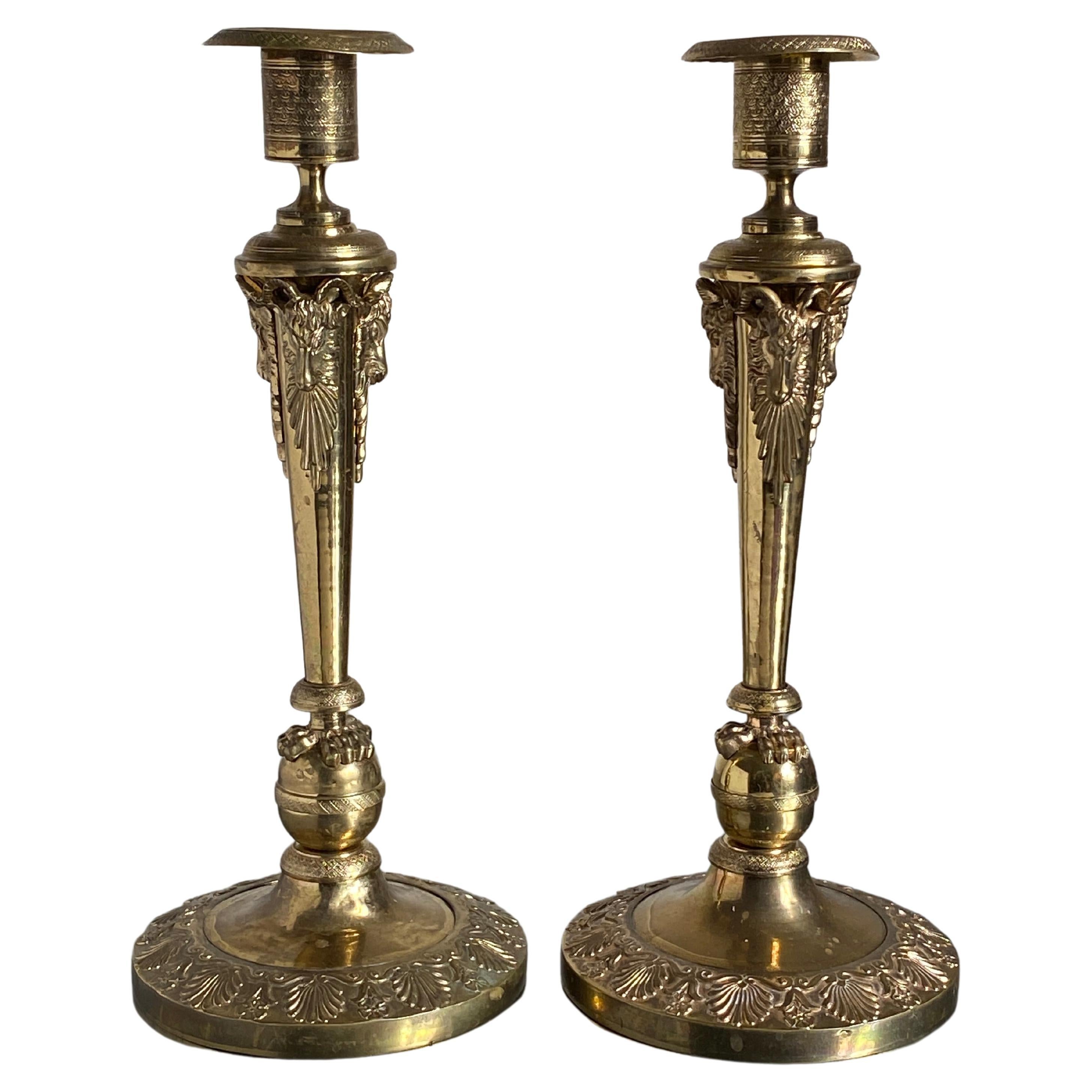 A Pair of Russian Empire gilt bronze candlesticks produced in France / Russia around 1810 in the manner of Pierre-Philippe Thomire

Of substantial size and expertly cast in matt and burnished gilt bronze. 

This model was often attributed to the