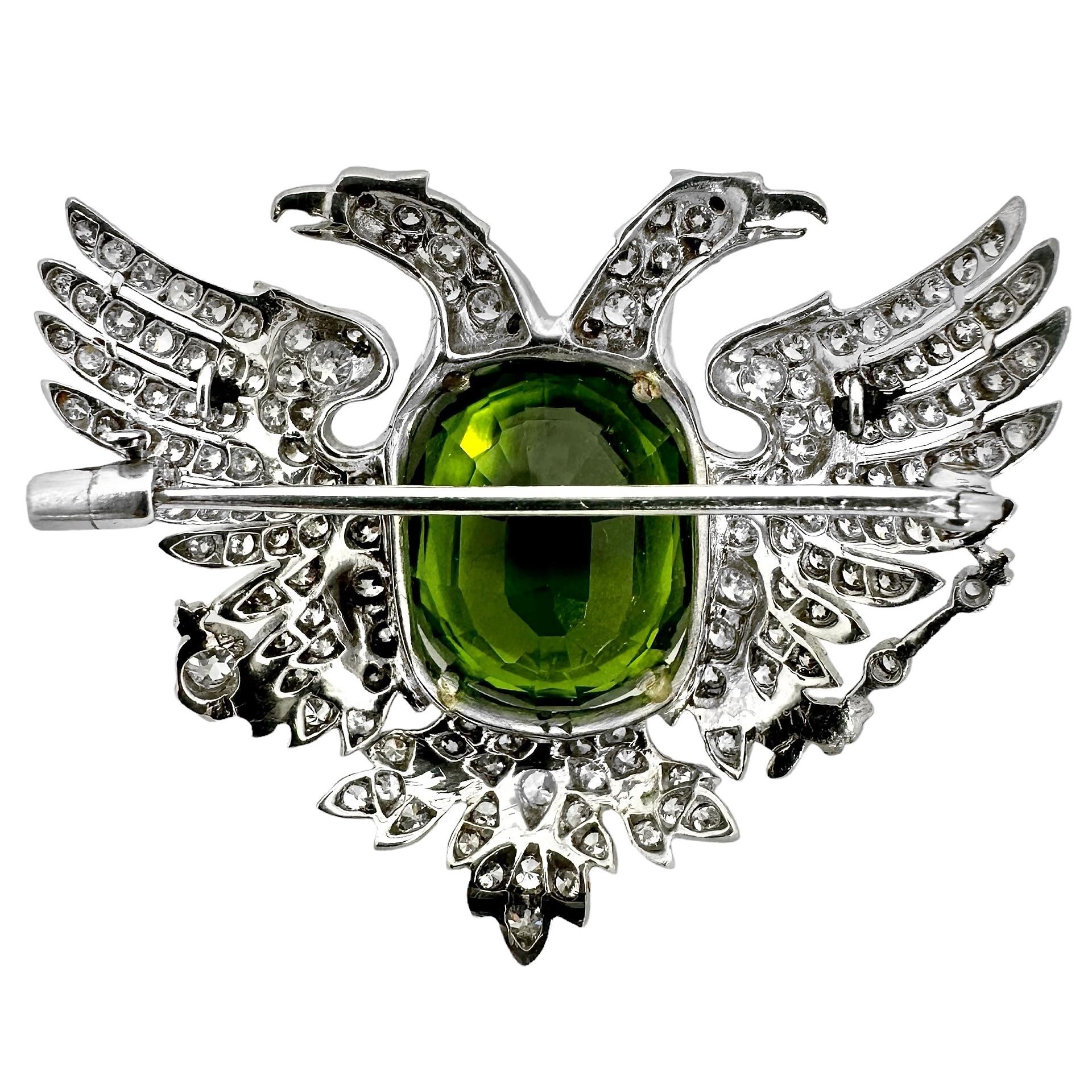 This amazing vintage platinum Russian Empire period brooch was deftly crafted depicting a double headed eagle holding a royal scepter with his right talon and a royal orb in his left. A Russian monarch would seat himself on the throne during the