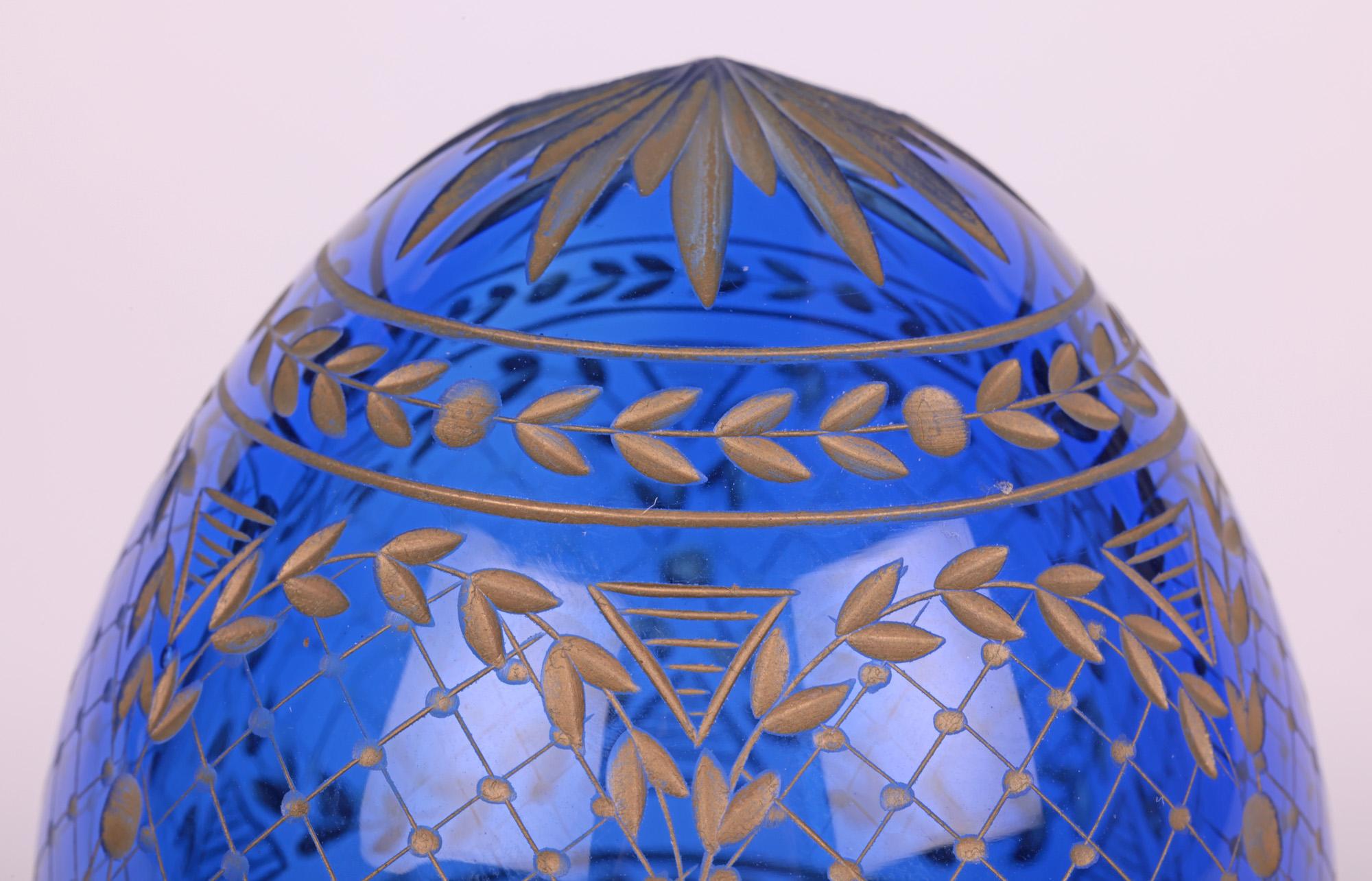 A fine quality large antique/vintage Russian hand-blown engraved cobalt blue glass egg attributed to Faberge and probably dating from the early 20th century. The egg is hollow hand blown and finely made with a small flat polished foot with central
