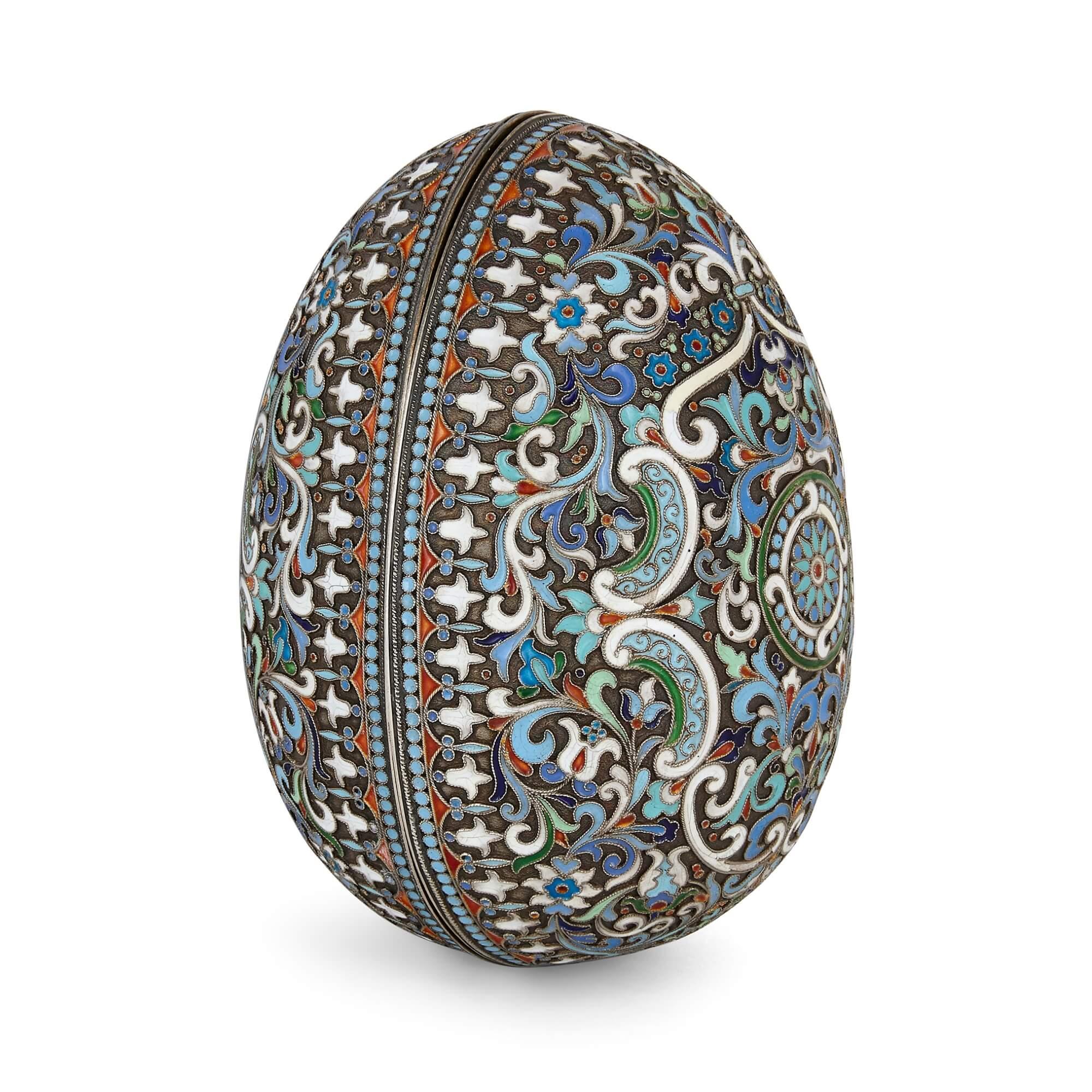 Russian Fabergé style cloisonné enamel Easter egg
Russian, 20th Century
Height 12.5cm, diameter 9.5cm

This delicately patterned Russian egg is of typical form and crafted in gilt silver. The entire surface of the egg is decorated all over in the