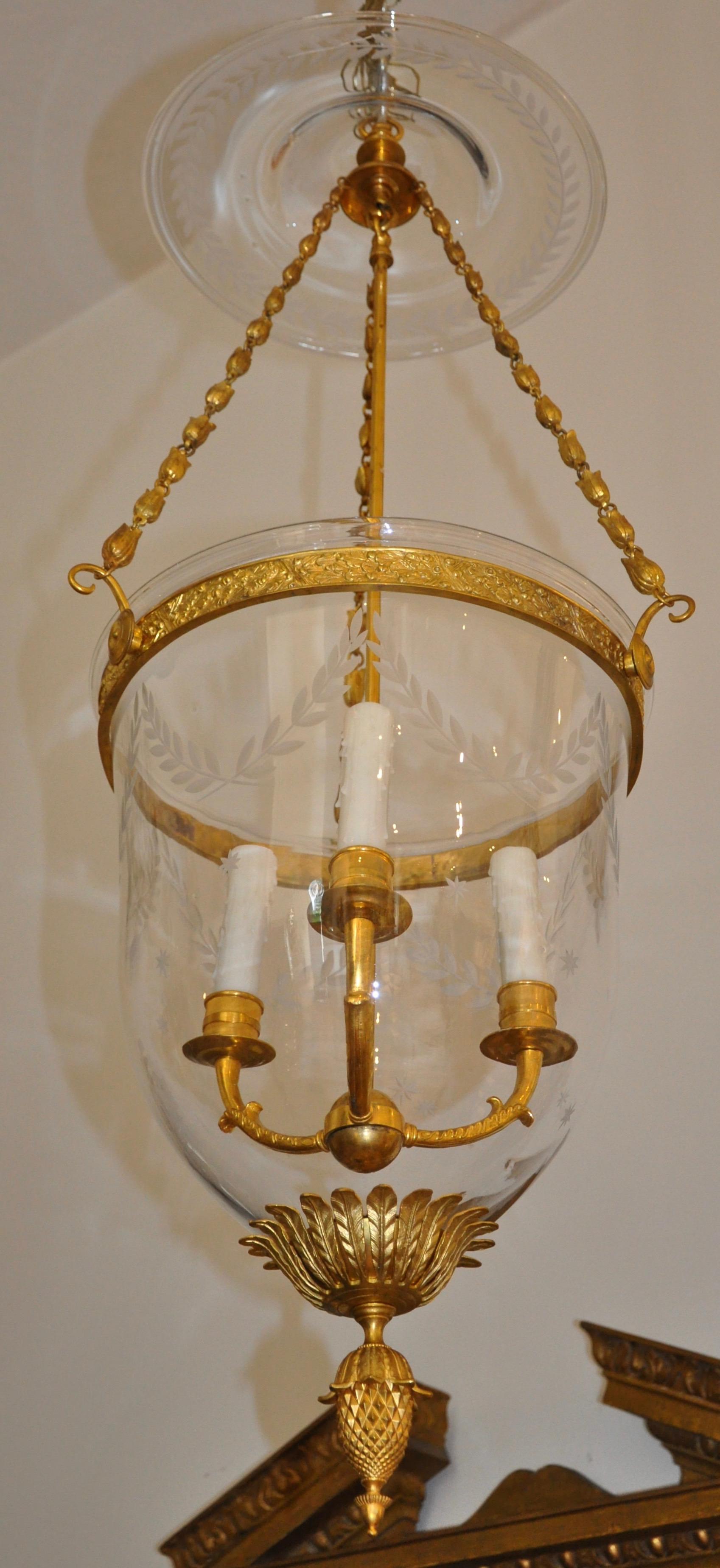 Impressive scale early 20th century Russian neoclassical gilt bronze hall lantern chandelier

--hand blown bell jar and smoke shade, deeply etched with laurel swags and stars in neoclassical motif. Gilt bronze bell-flower chain. Bottom with