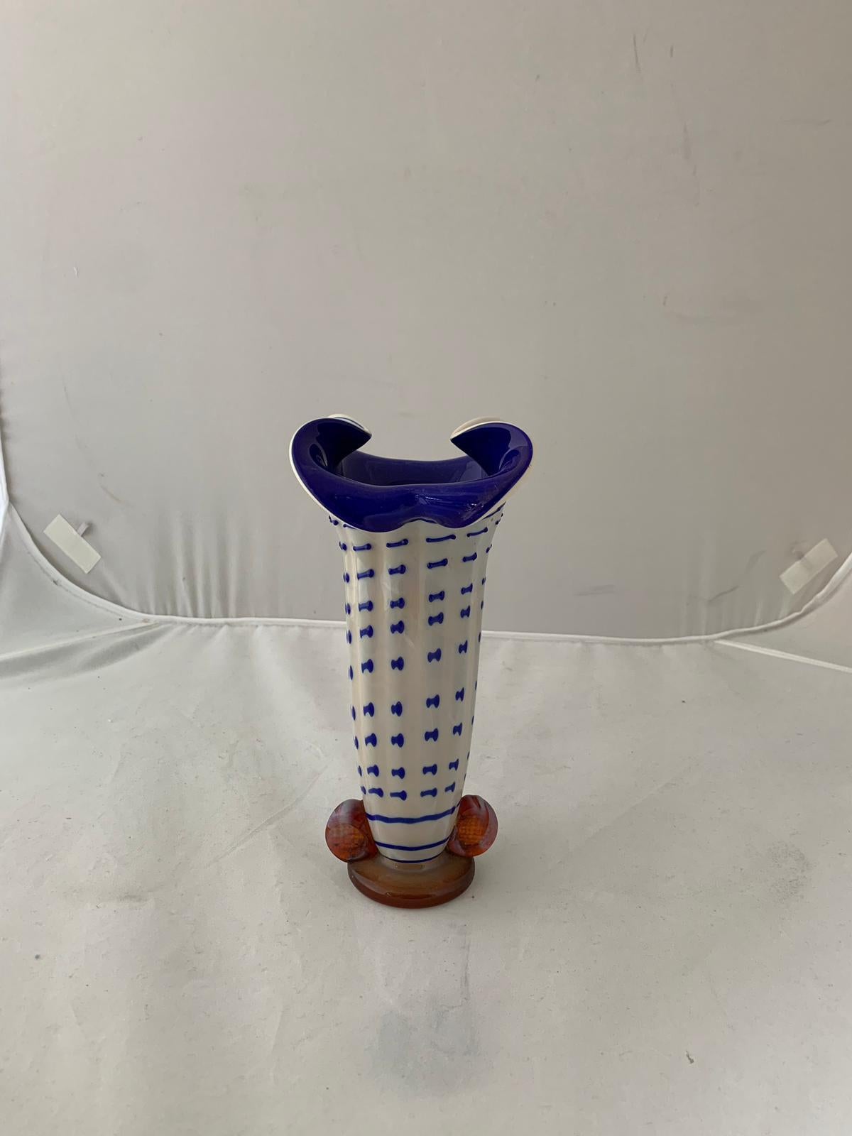 Vase in lattimo glass in zinc sulphide decorated and blue coated, the base and the two stapled supports in honey-cognac glass shaded lattimo, the vase is decorated with dotted lines towards the mouth and become material and join together circuiting