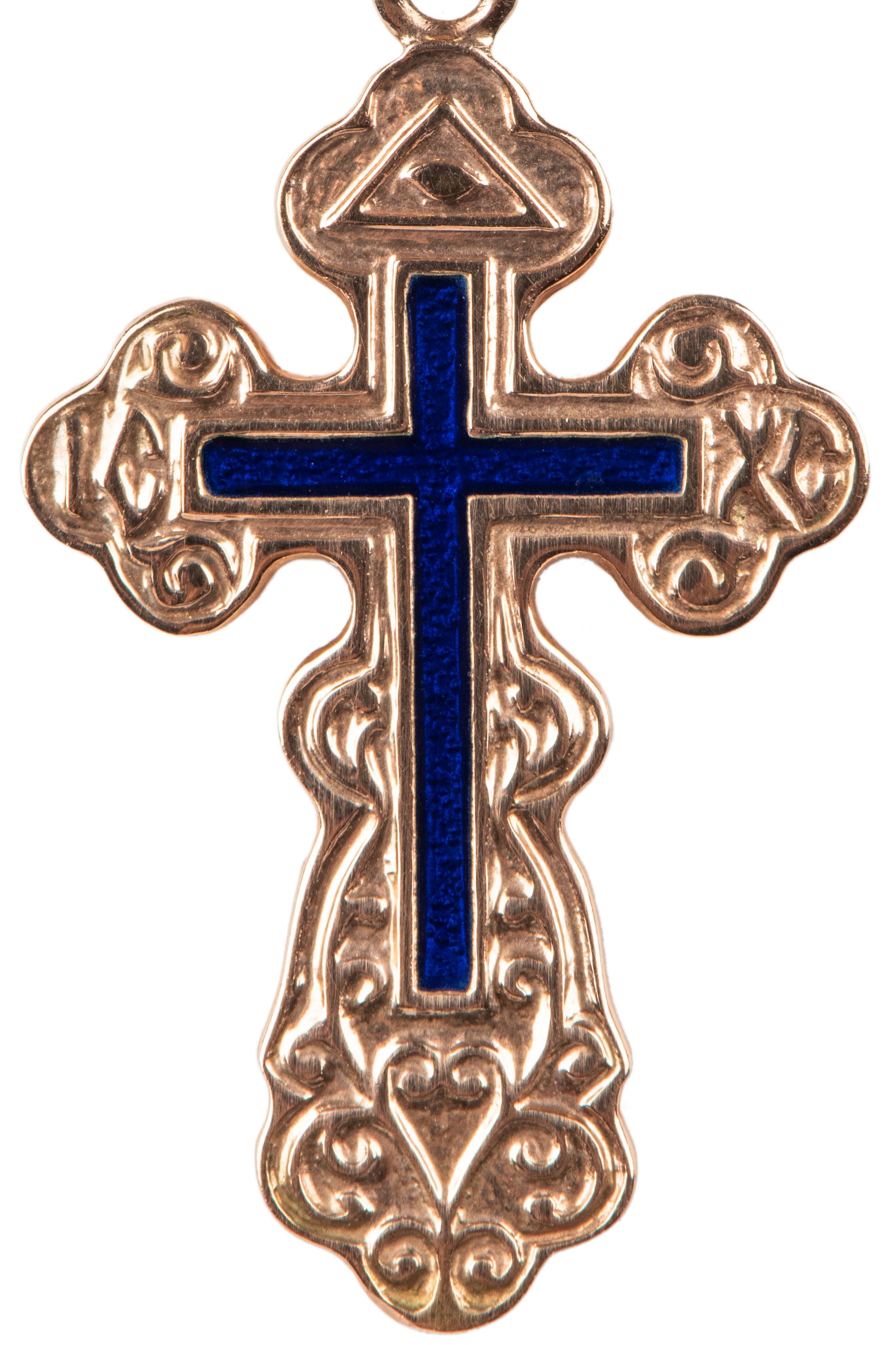A small Russian rose gold Orthodox cross, the front enamelled in deep blue enhanced with scrolls recalling pre-revolutionary Russian designs. Made in St. Petersburg, Russia.

St. Petersburg, 1990s.

1 5/16 in. (3.3 cm.) including suspension ring.