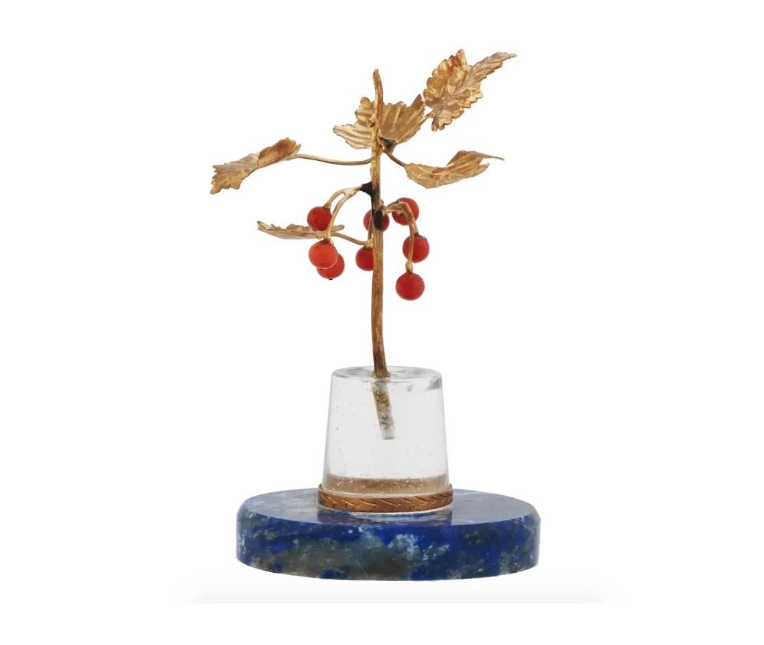 A miniature decor representing a rowan branch in a vase. The vase is made of rock crystal and is mounted on an azurite base. The 18K gold branch has red coral berries. Presumably of Russian origin, Faberge style. Collectible Jewelry And Decor For