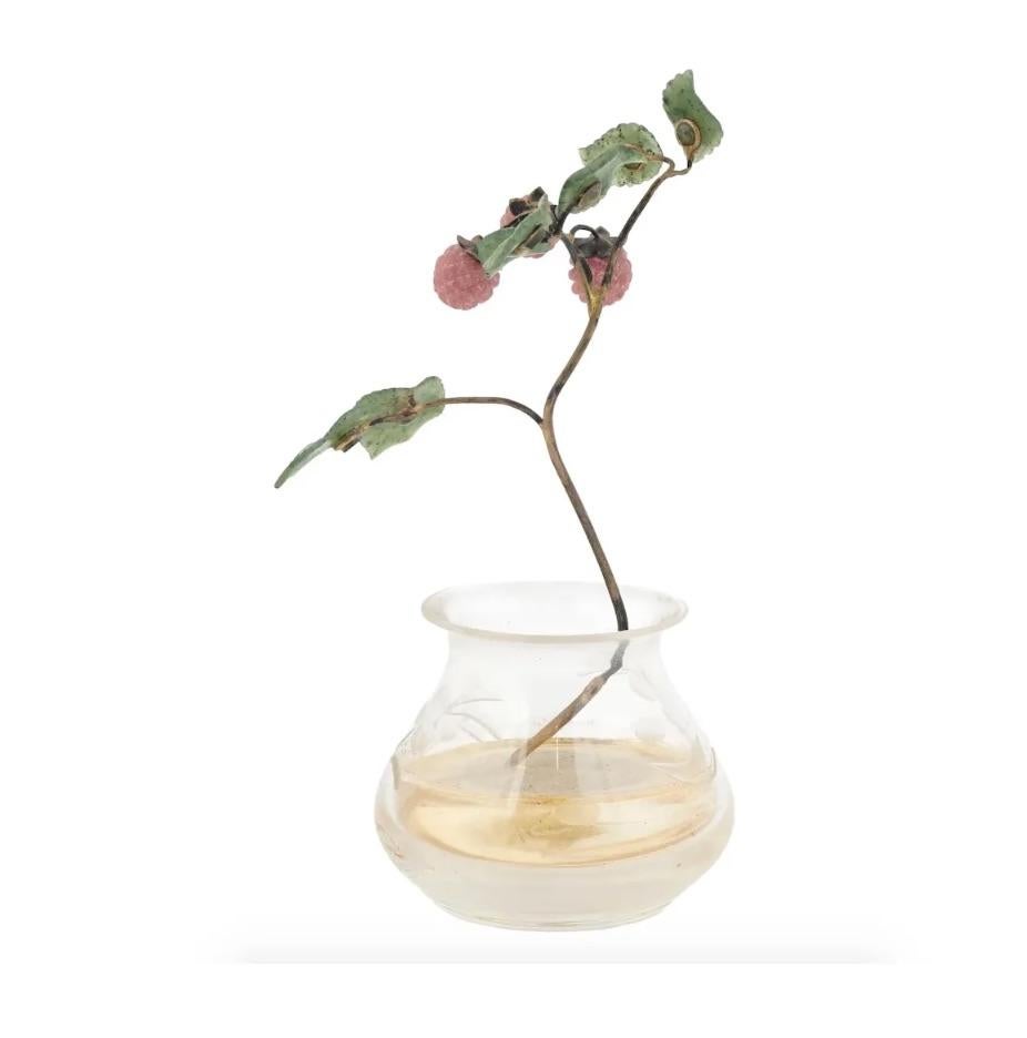 A miniature decor representing a raspberry branch in a vase. The vase is made of rock crystal with decorative etching. The gold branch has carved pink amethyst berries and nephrite jade leaves. Presumably of Russian origin, Faberge style.