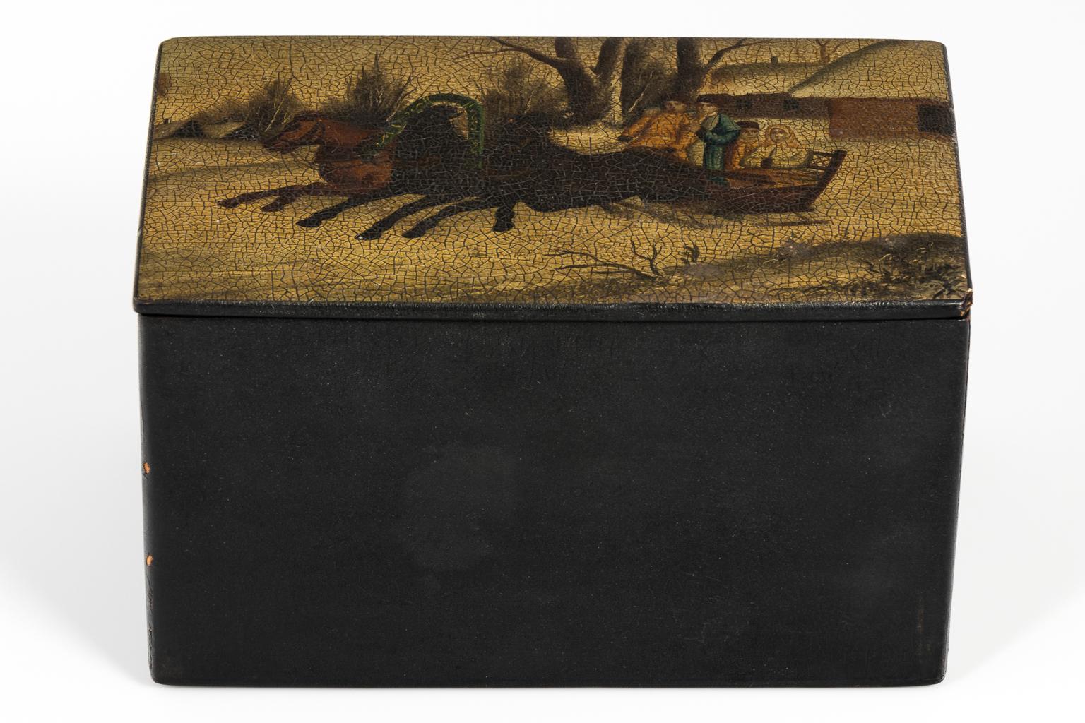 Lacquered Russian hand-painted tea box with a horse drawn sled theme, circa early 20th century.
 