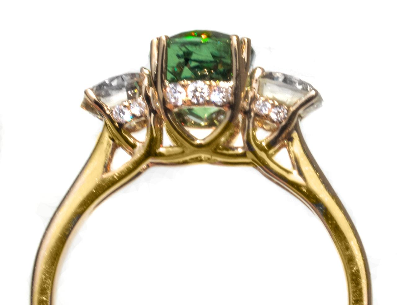 This beautiful gemstone ring has one of the rarest and most sought-after gemstones – The Russian Demantoid Garnet. This garnet has a gorgeous color... it's a perfect emerald green. We love this gorgeous gemstone’s color and gemmy sparkle. Demantoid