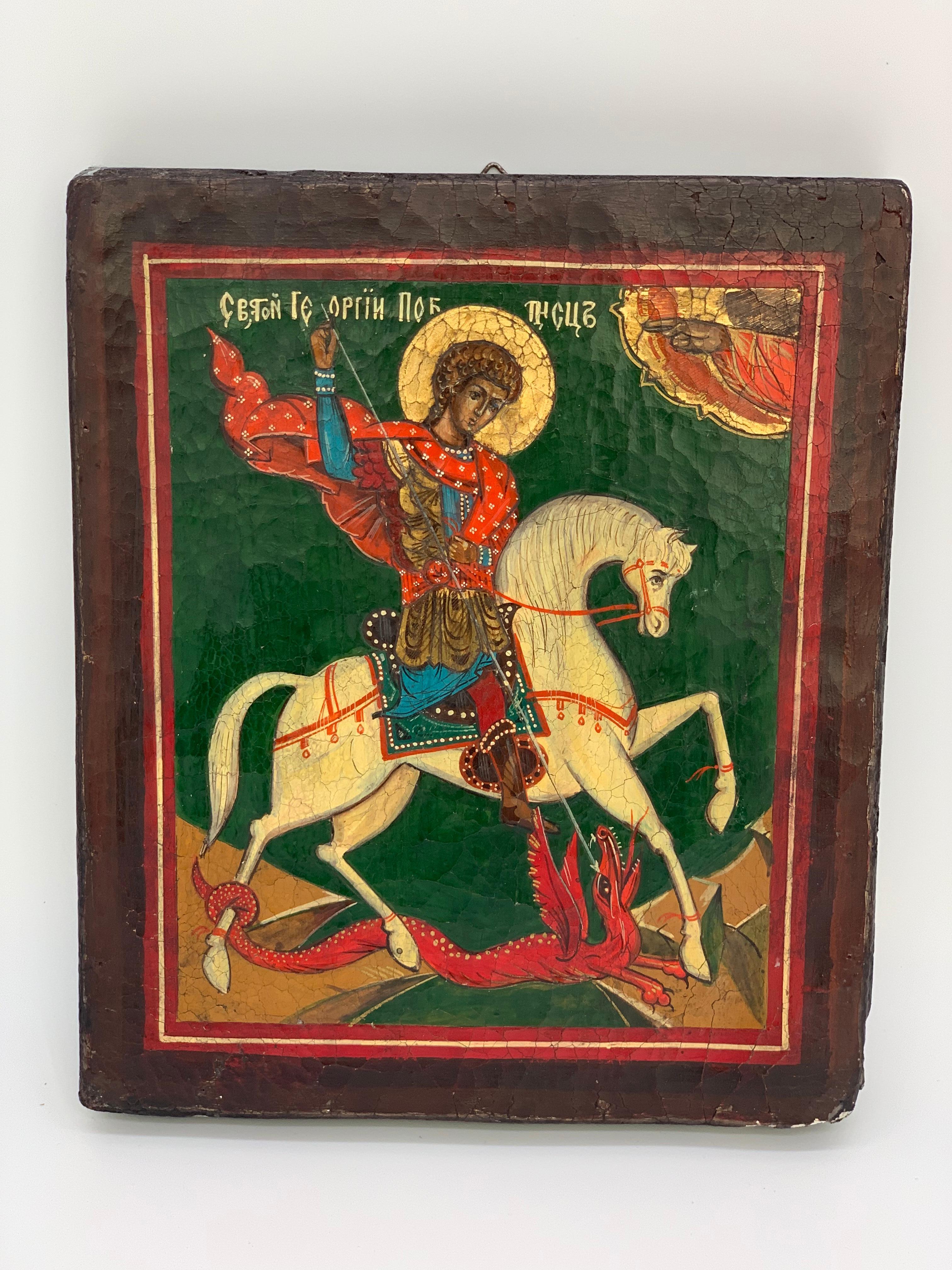 Beautifully painted Icon of Saint George slaying a dragon on white horse. Painted in beautiful detail.
19th century Russian Icon with green, red, white and blue.

         