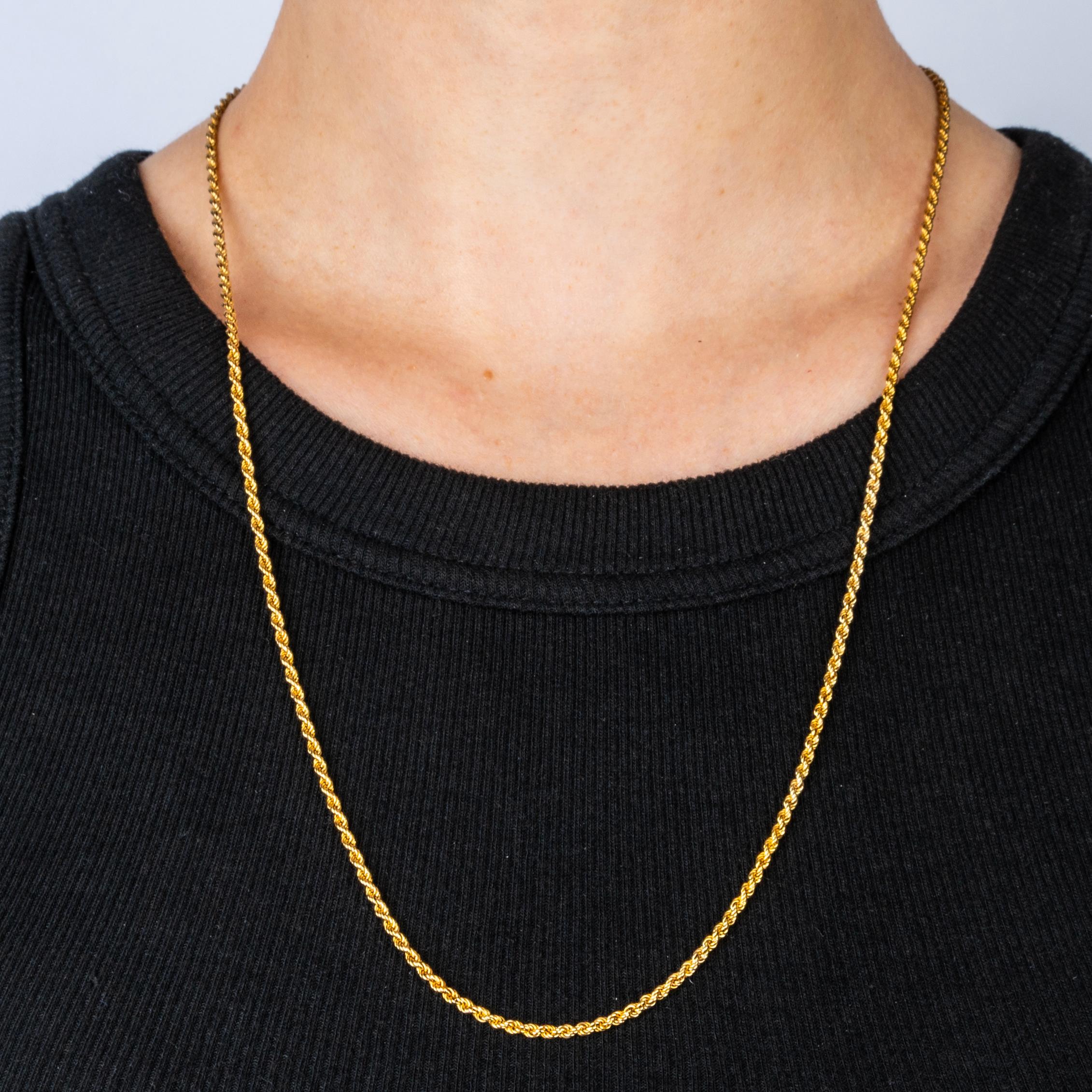From the Romanov era, period of Tsar Nicholas II, a rare Russian 14k yellow gold rope chain from Moscow, with original Russian 14k rose gold clasp. 

Clasp stamped with the kokoshnik hallmark for circa 1900

25 in. (63.5 cm) long including