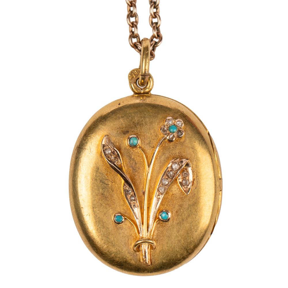 This rare Russian 14k yellow gold locket from St. Petersburg, circa 1900 was created during the Romanov era of Tsar Nicholas II. The front of the oval yellow gold locket applied with a rose gold bouquet set with rose diamonds and turquoise