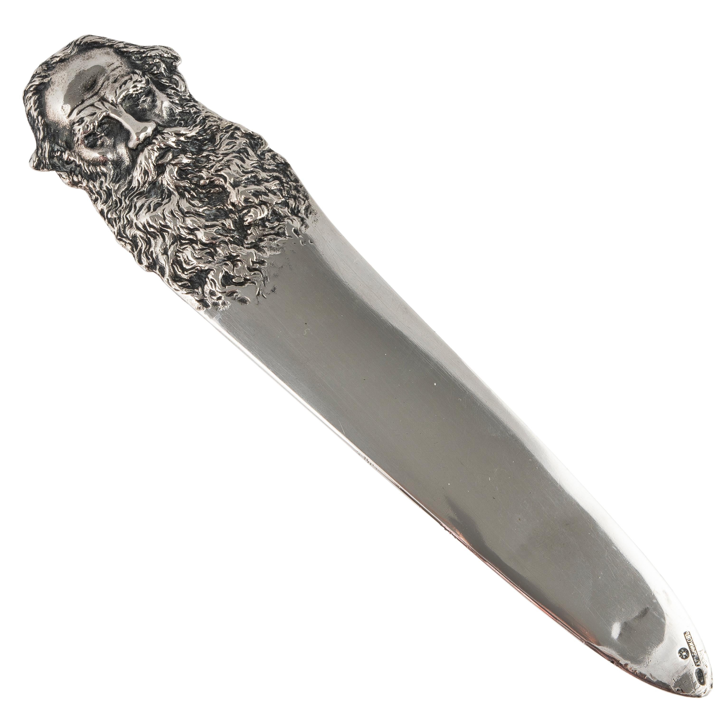 A rare Romanov-era Russian silver letter opener or paper knife from the period of Tsar Nicholas II, the handle which features a repoussé silver bust of Count Leo Tolstoy with a flowing beard is probably based on the enclosed photograph of the author