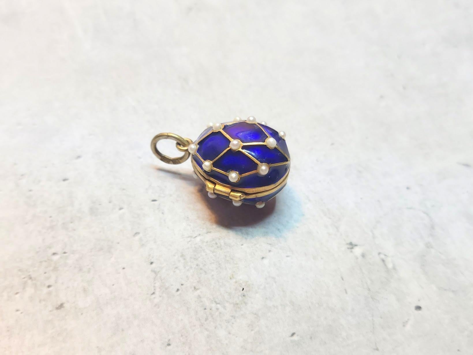 We are pleased to present a rare and exquisite Imperial medallion, crafted in the form of a gilded silver egg adorned with fine enamel and natural pearls. This magnificent piece of jewelry was created in Saint Petersburg at the beginning of the 20th