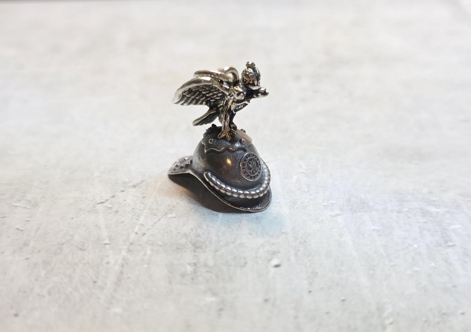 A Unique Imperial Jewel: The Horse Guard Helmet Pendant

We present an exquisite pendant crafted from 84-zolotnik silver-gilt, designed as a miniature parade helmet adorned with a double-headed eagle, the globus cruciger, and Moscow’s historic