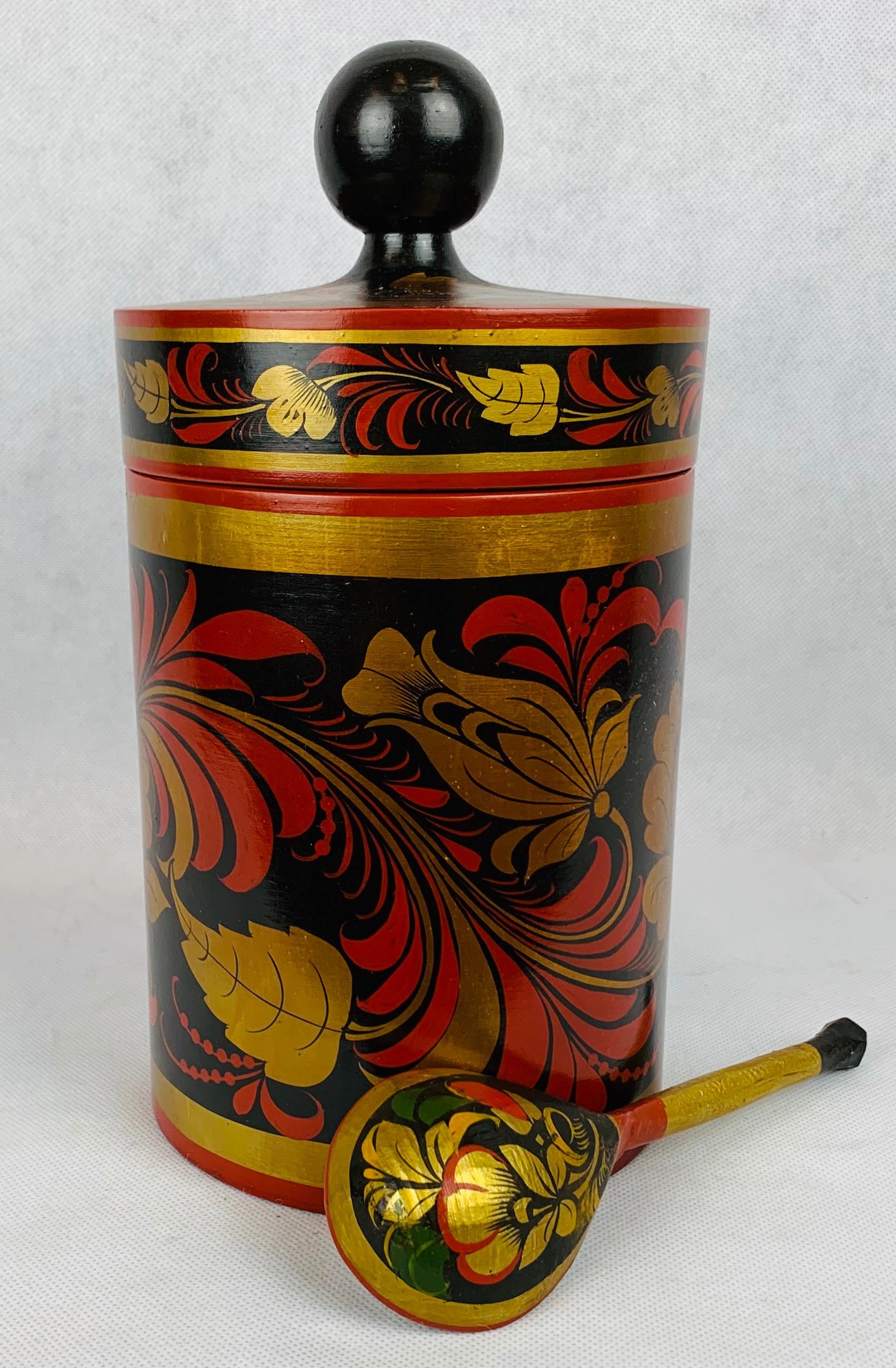 Russian lacquer tea canister with spoon made from solid Linden wood. Hand painted with lacquer in the traditional folk manner. If not used for tea why not use it for cookies or other food items. 

The original certificate of authenticity is included.