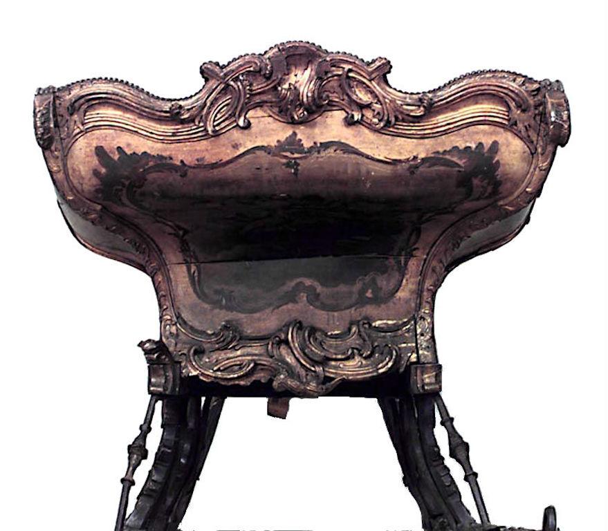 Russian (18/19th Cent) large painted and gilt trimmed carved sleigh with green velvet seat
