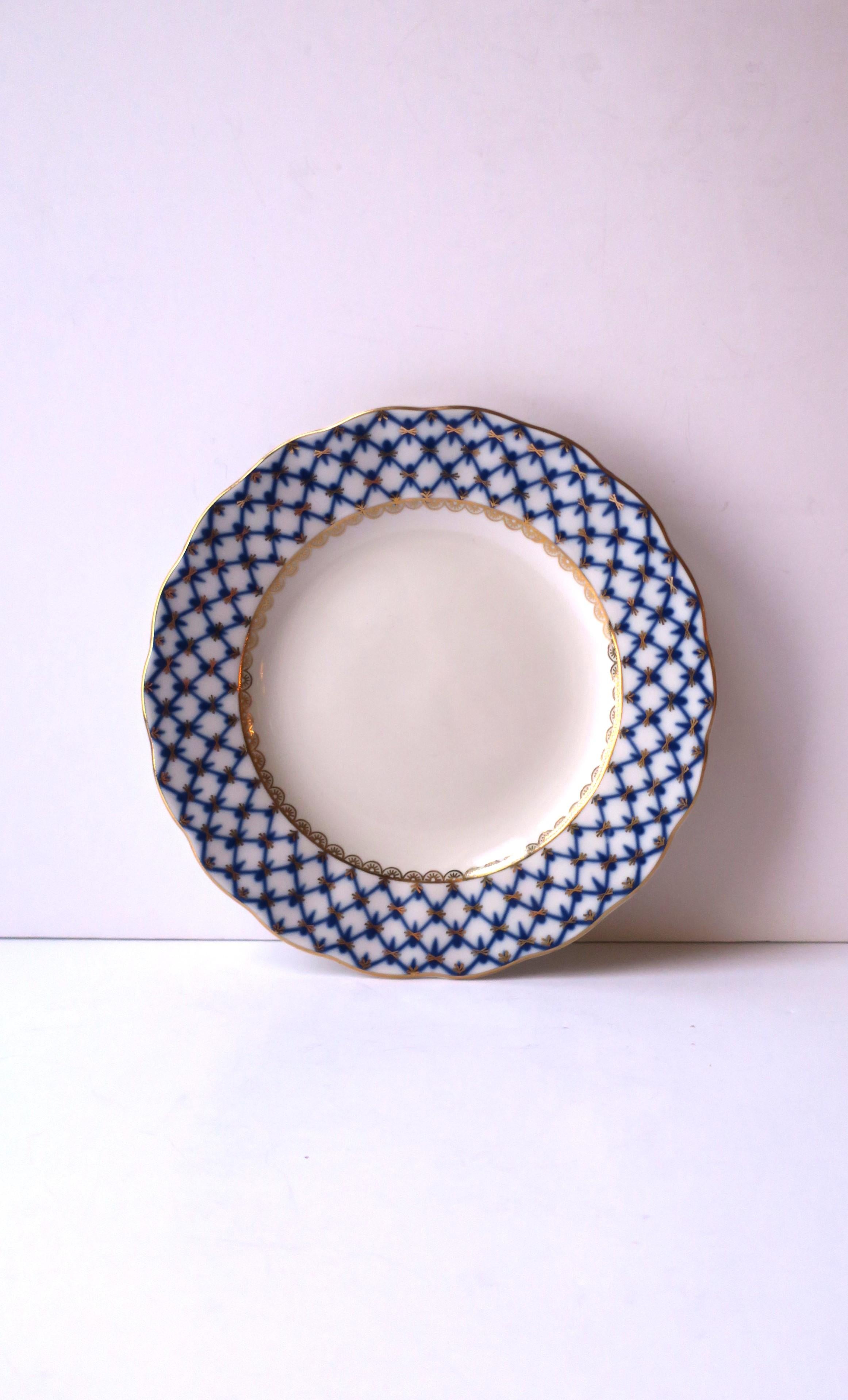 A beautiful Russian blue, gold and white porcelain plate in the 'Cobalt Net' pattern by Lomonosov Porcelain, Russia, circa late-20th century, after 1991. With makers' mark and marked 'Made in Russia' on bottom as shown in last. Dimensions: .88