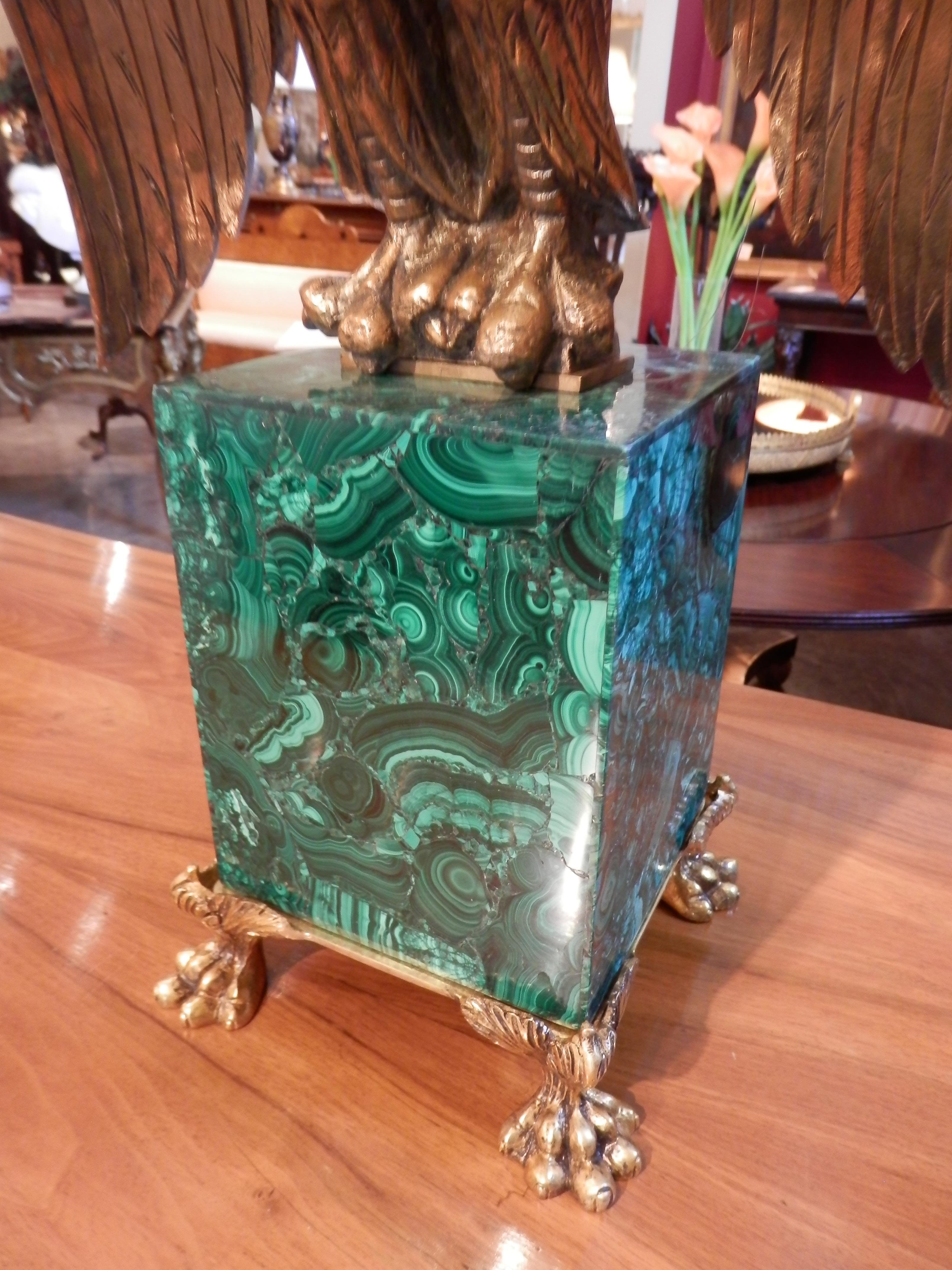 Early 20th century Russian gilt bronze large Eagle on a Malachite base with bronze pawed feet.