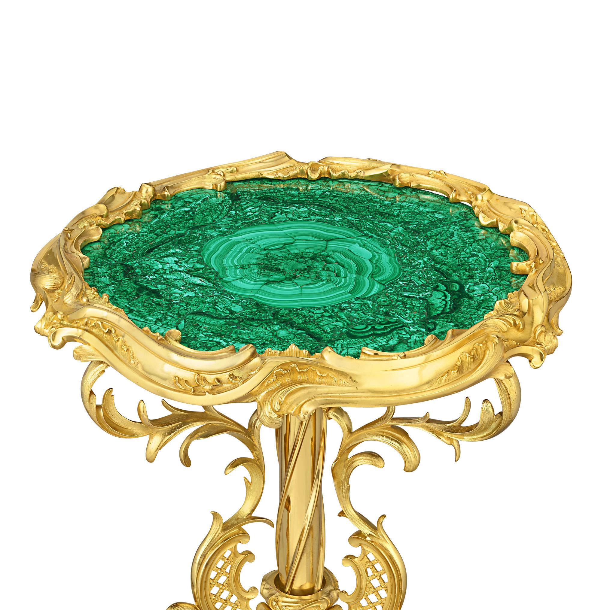 This magnificent 19th-century Russian gueridon is crafted from striking green malachite and gilt bronze. A beautiful museum-quality work, the stunning green malachite table top is set within an exquisitely sculpted 