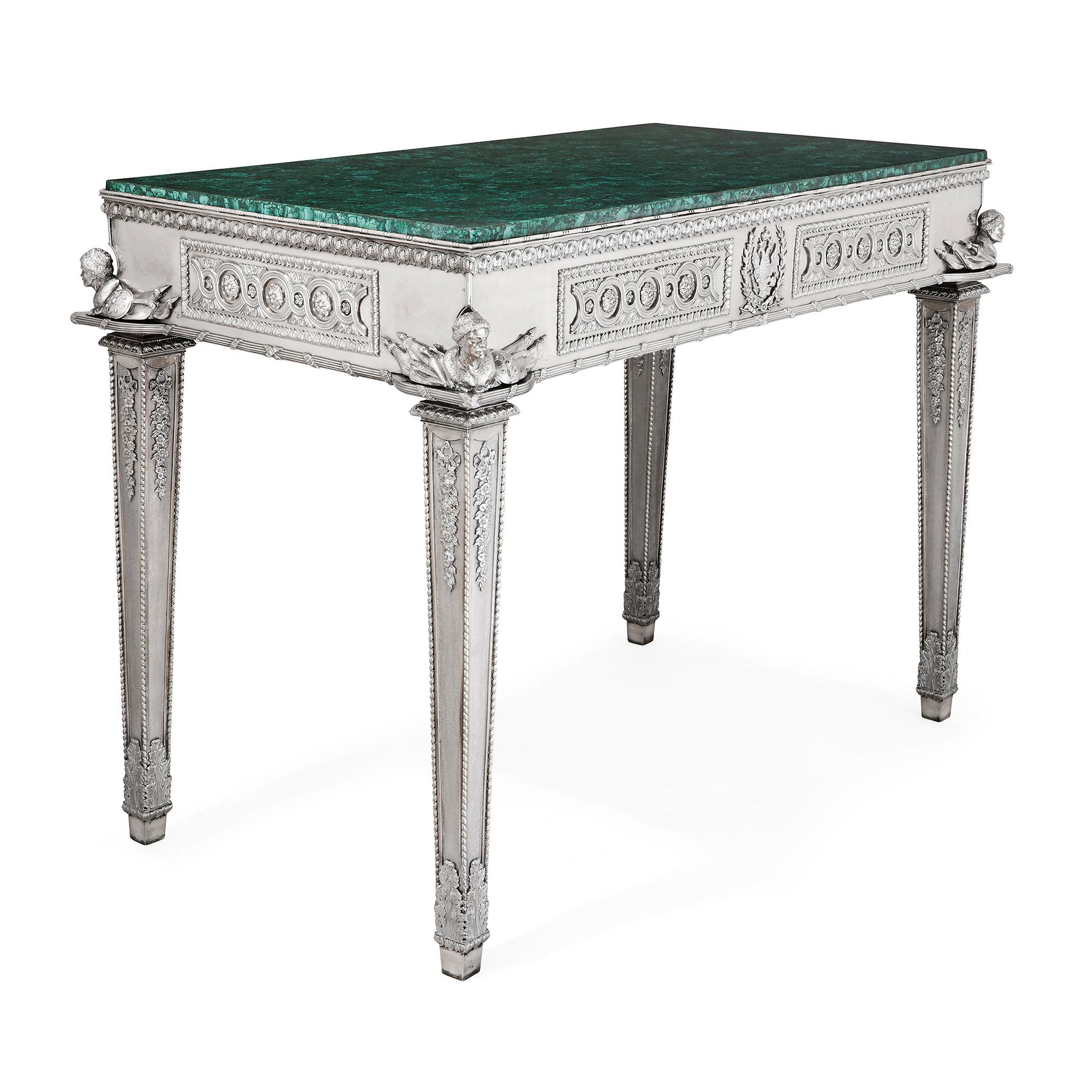 Russian malachite and silver table by Imperial silversmiths the Grachev Brothers
Russian, 1884
Measures: Height 85cm, width 113cm, depth 63cm

This beautiful silver table was manufactured by the Grachev Brothers, who were important makers within