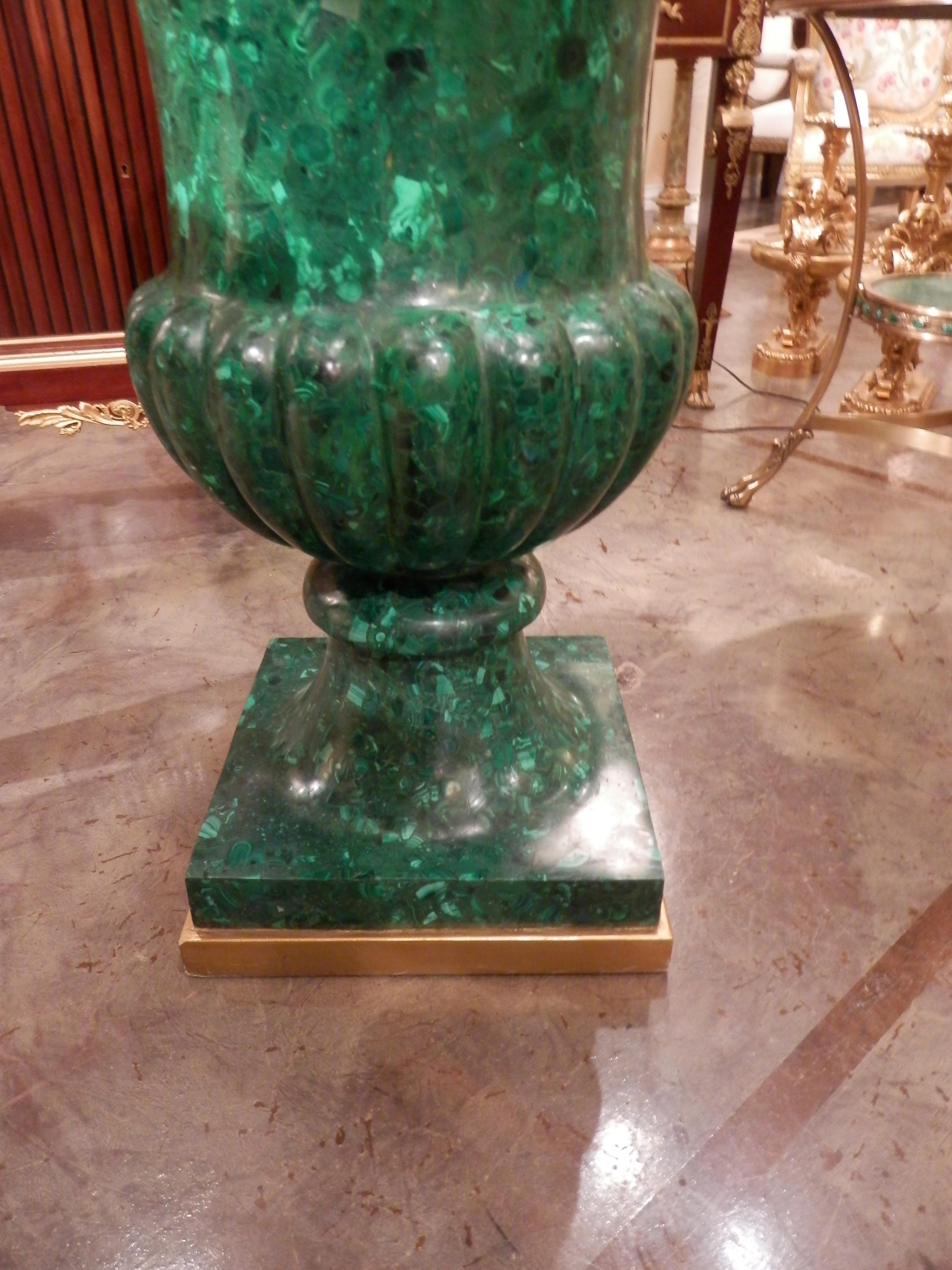 Rare large Russian malachite urn. Finely detailed on a square plinth base.