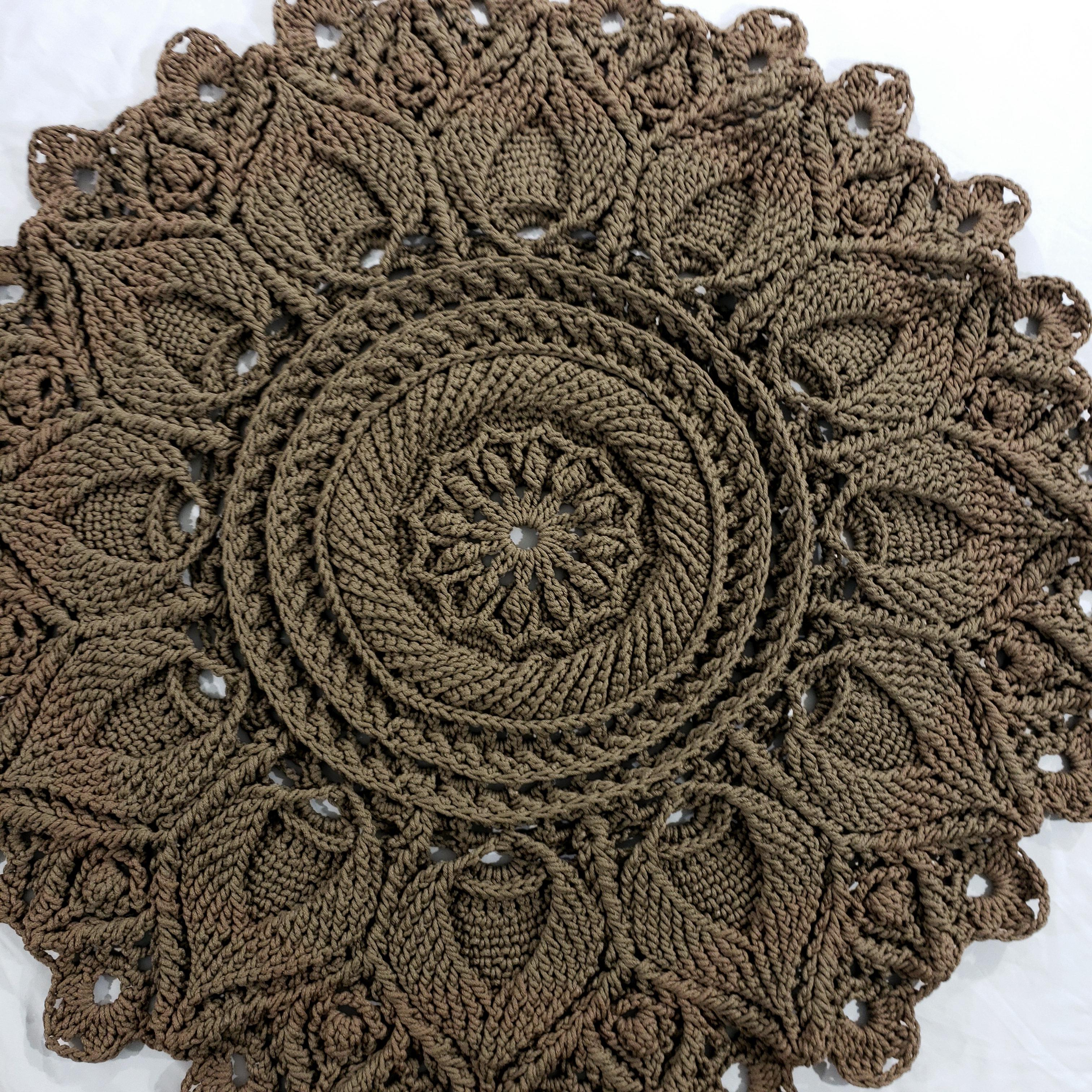A crochet round mandala rug with layered petals, hand-made with traditional Russian textile techniques. 
A modern decoration with the charm and style of vintage carpets. Add an elegant dimension to any room with this luxurious item!
...

52 inches