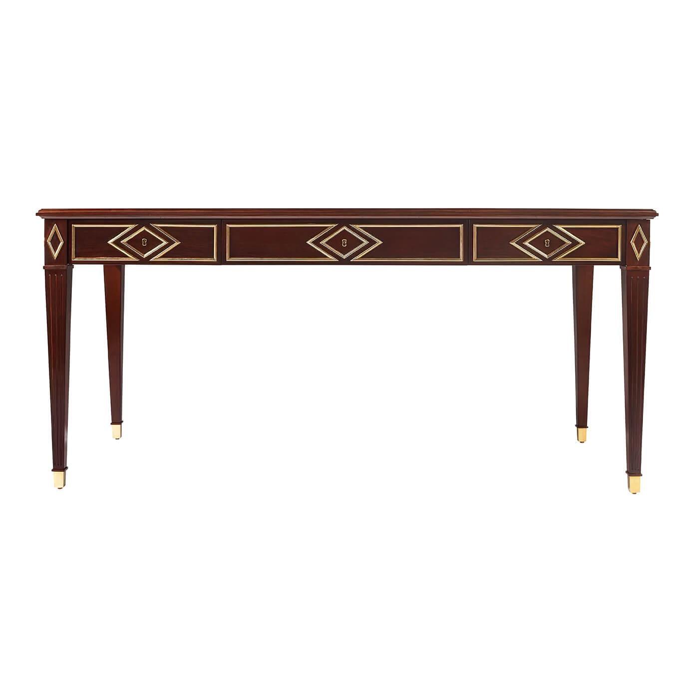 A Russian neoclassic style desk with brass details on the frieze in a classic diamond pattern influenced by 19th century Russian designs, with an inset leather top writing surface and rasied on square tapered and fluted legs.

Dimensions: 65