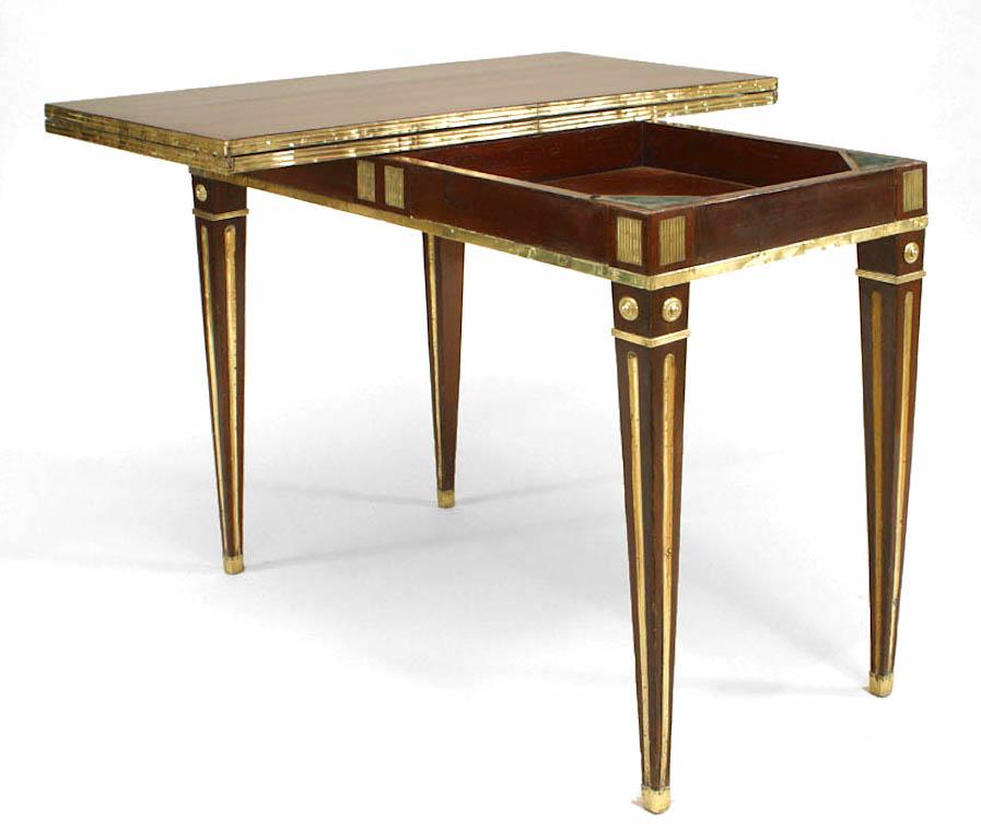 Russian Neoclassic (late 18th/early 19th Century) brass mounted mahogany game table console with pivoting top opening to a square green suede inset playing surface.
