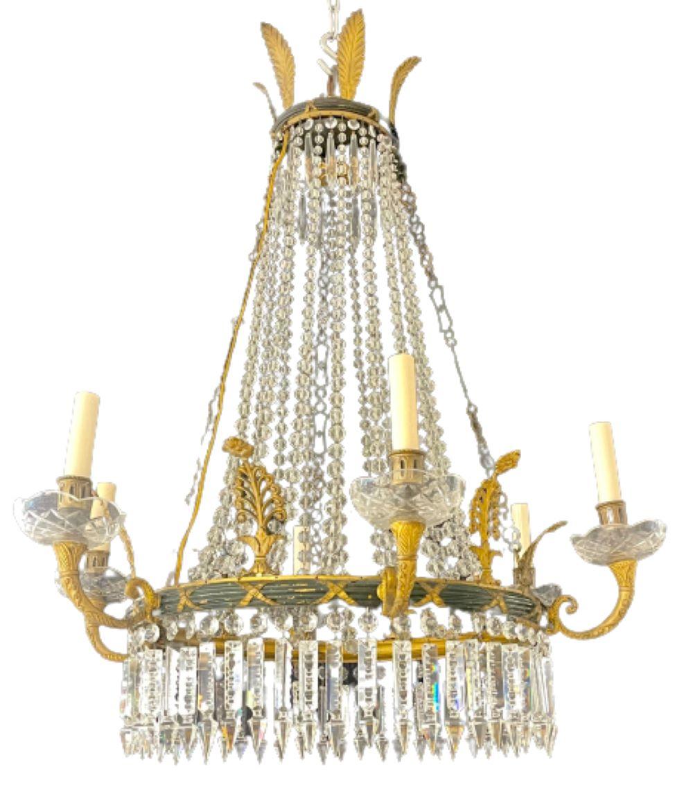 Russian neoclassical six light chandelier. Bronze and crystal decorated ballroom form chandelier having crystal bobeches under and ebony bronze central apron with matching tier on top having X form design. The whole supported by a strong center arm