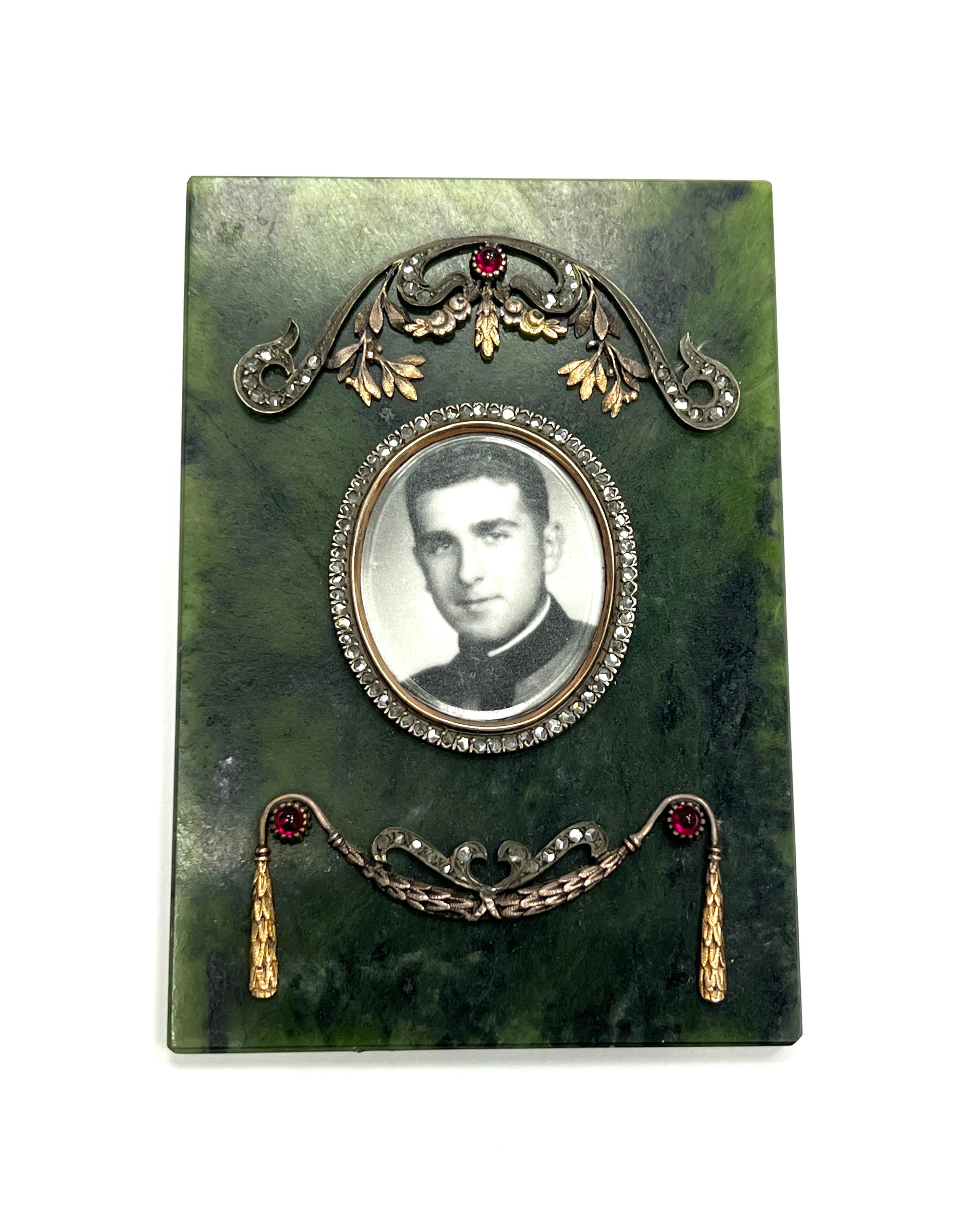 Russian Nephrite Silver and Gold Diamond Picture Frame

Nephrite frame with rose-cut diamonds and cabochon rubies; nephrite thickness 2.5 mm, oval frame dimensions 27 x 32 mm

Size: width 2.63 inches; length 3.88 inches
Total weight: 70.5 grams 