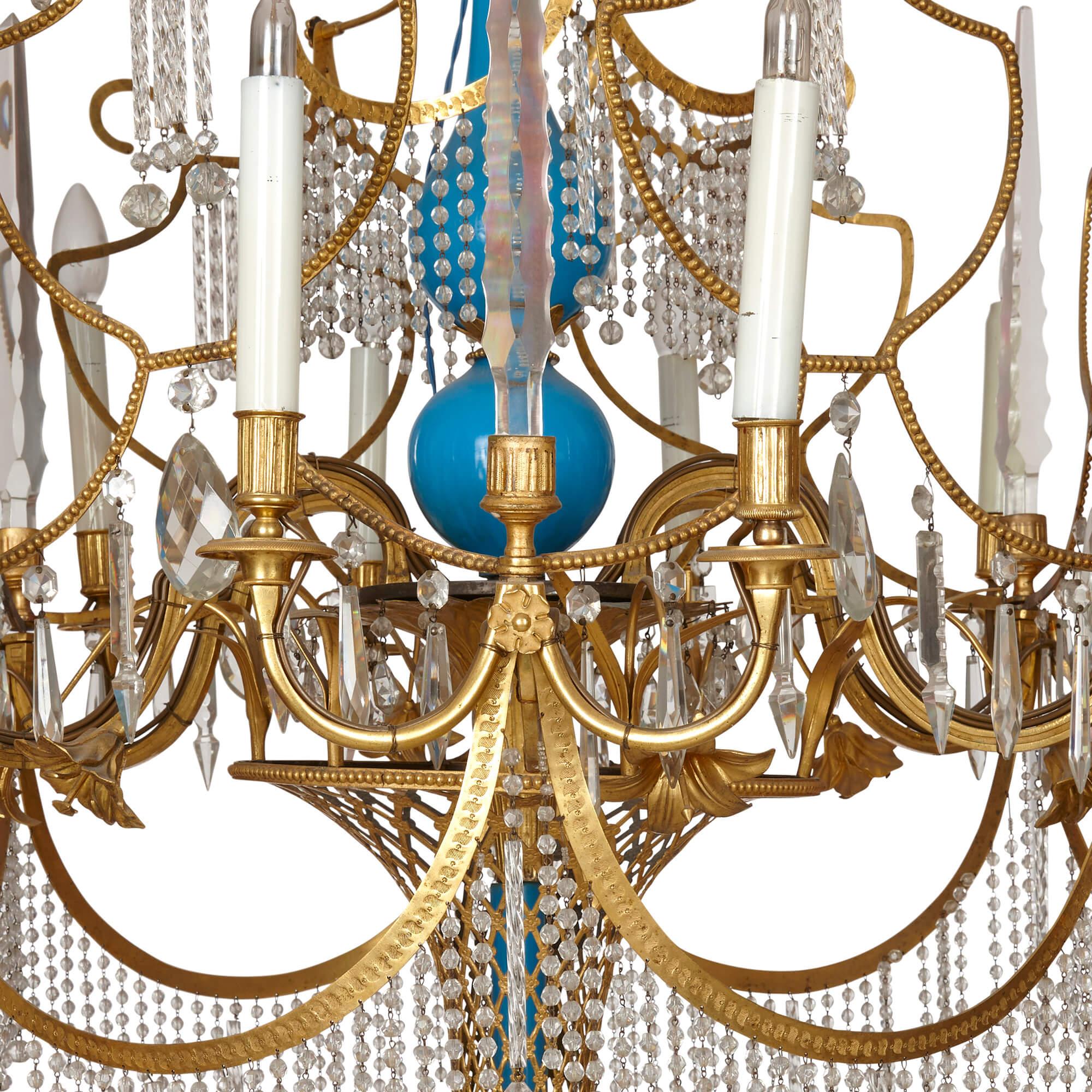 Russian cut-glass, ormolu, and blue porcelain chandelier
Russian, 19th Century
Height 120cm, diameter 90cm

This stunning Russian chandelier brings together vibrant turquoise porcelain, shining gilt bronze, and expertly cut glass in a remarkable