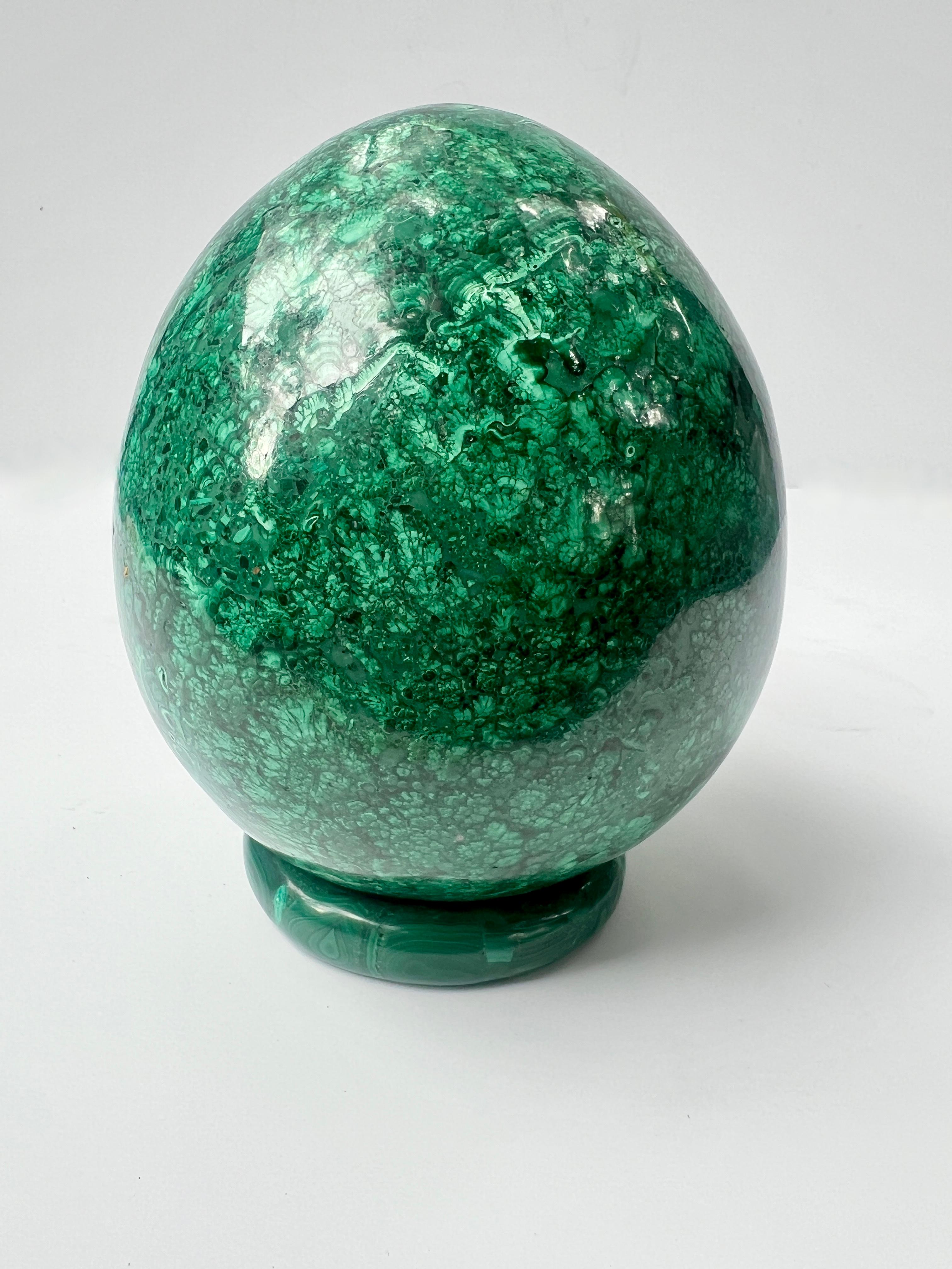 Patinated Russian Polished Malachite Shaped Egg On Malachite Band Stand For Sale