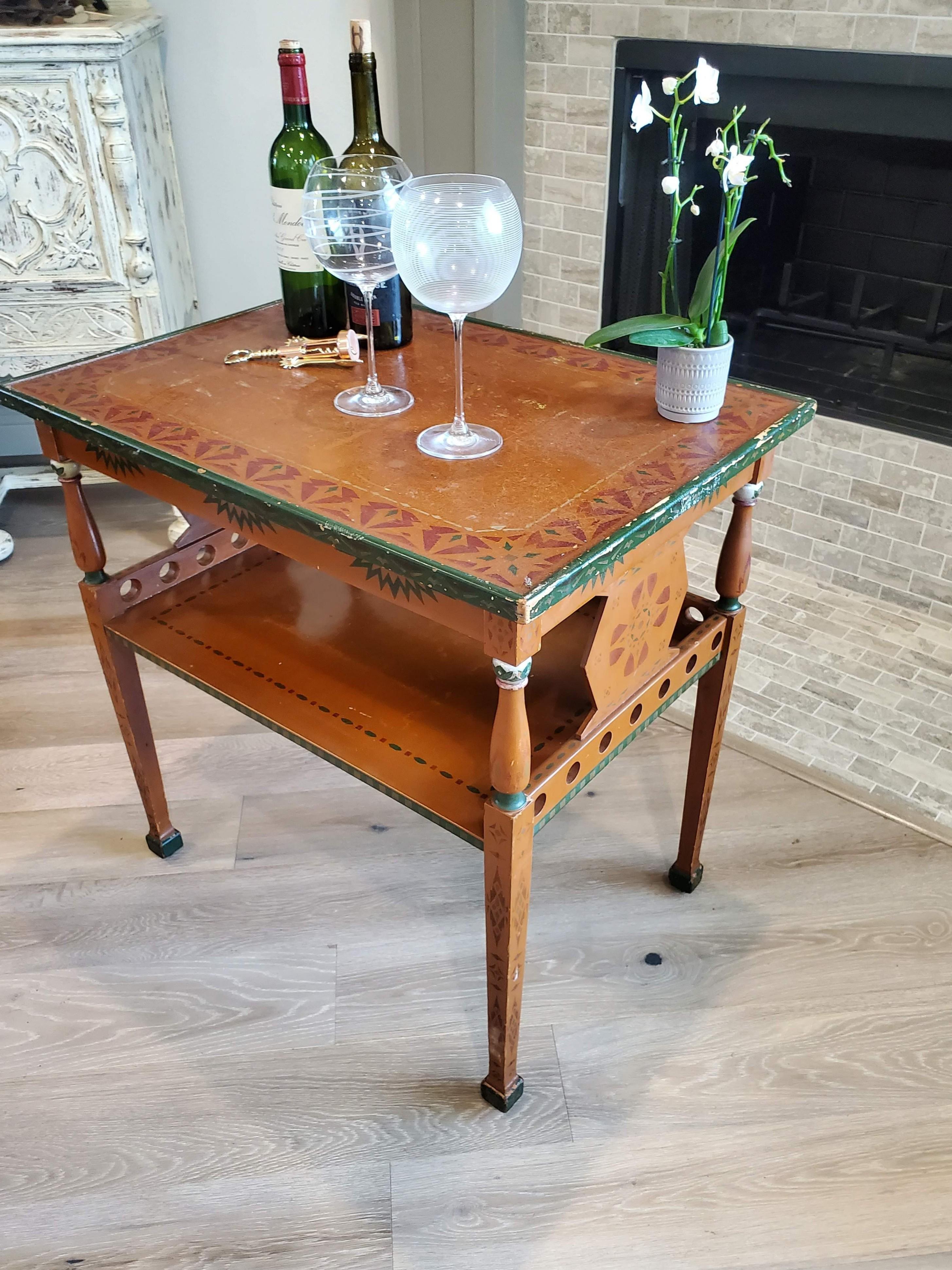 An exceptionally rare and unusual original Russian folk painted rolling tea table / dessert cart / side table. circa 1920

Russia, early 20th century, hand carved, painted, and laqueured solid wood two-tier frame, in Neoclassical inspired folky