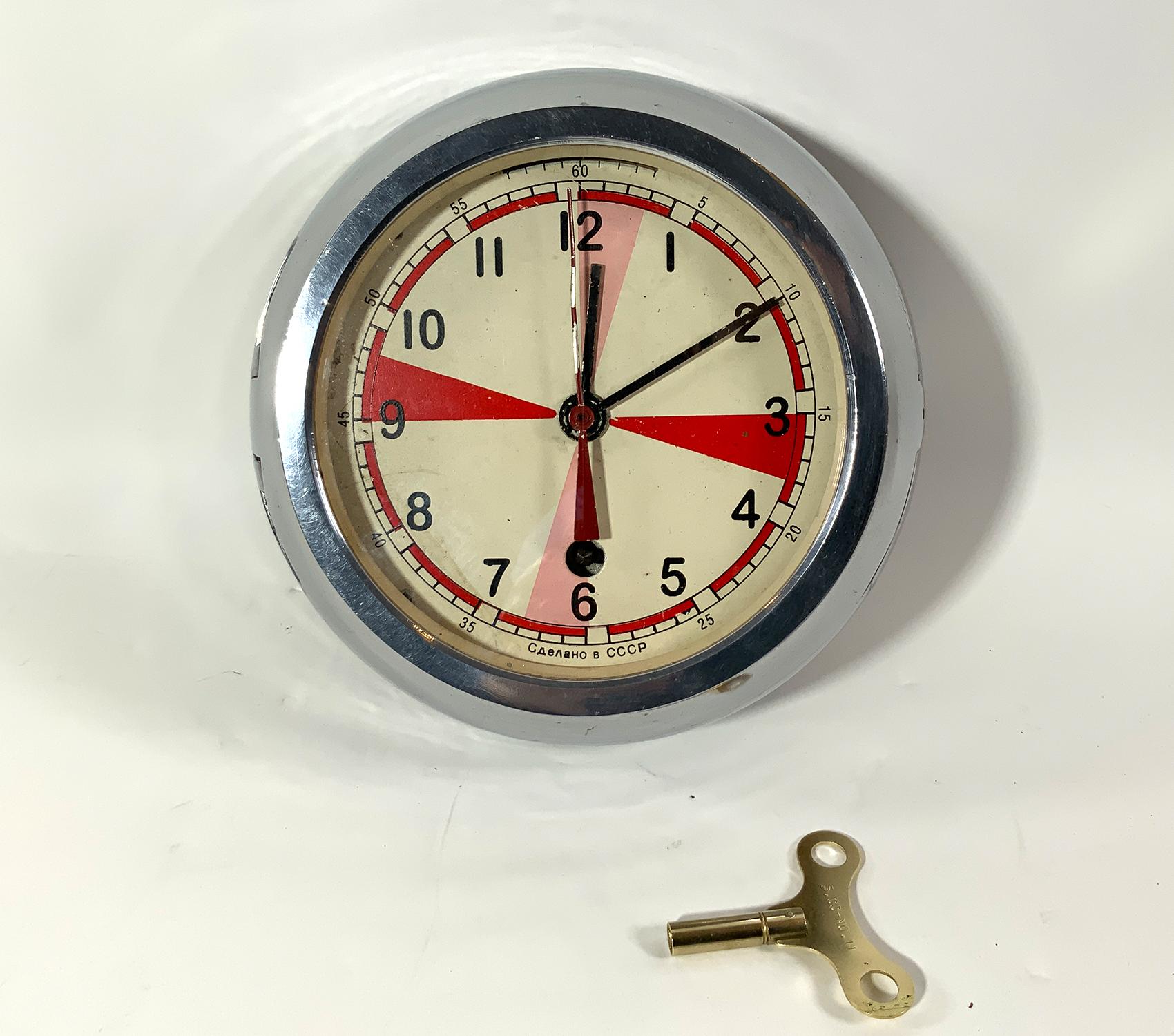 1950's Ships clock of Russian Manufacturing. Hinged door, key included. Clock is running clock case is nickel plated. Circa 1950.