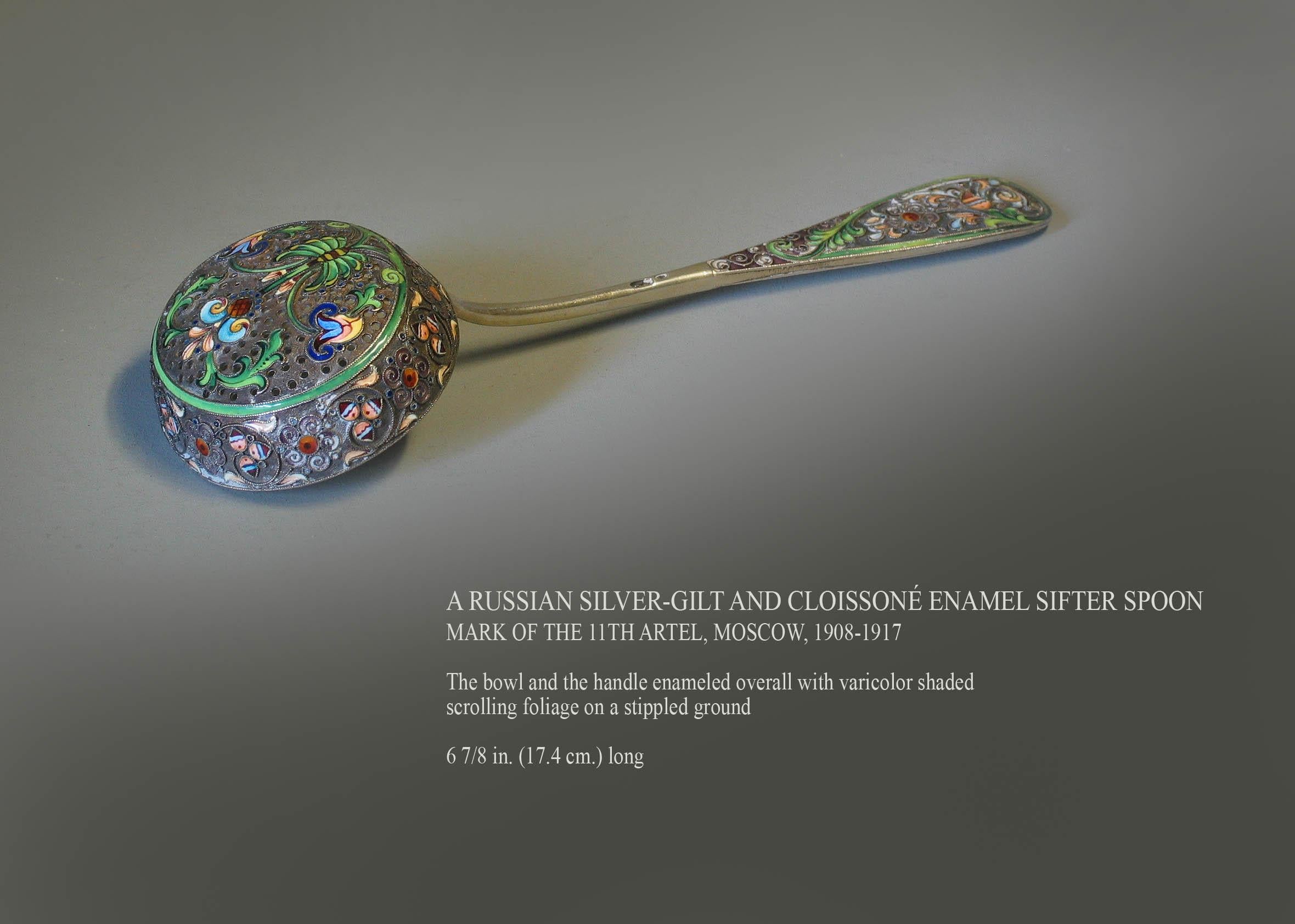 A Russian silver-gilt and Cloissoné enamel sifter spoon
Mark of the 11th artel, Moscow, 1908-1917

The bowl and the handle enameled overall with varicolor shaded 
scrolling foliage on a stippled ground, exceptional workmanship which is expected