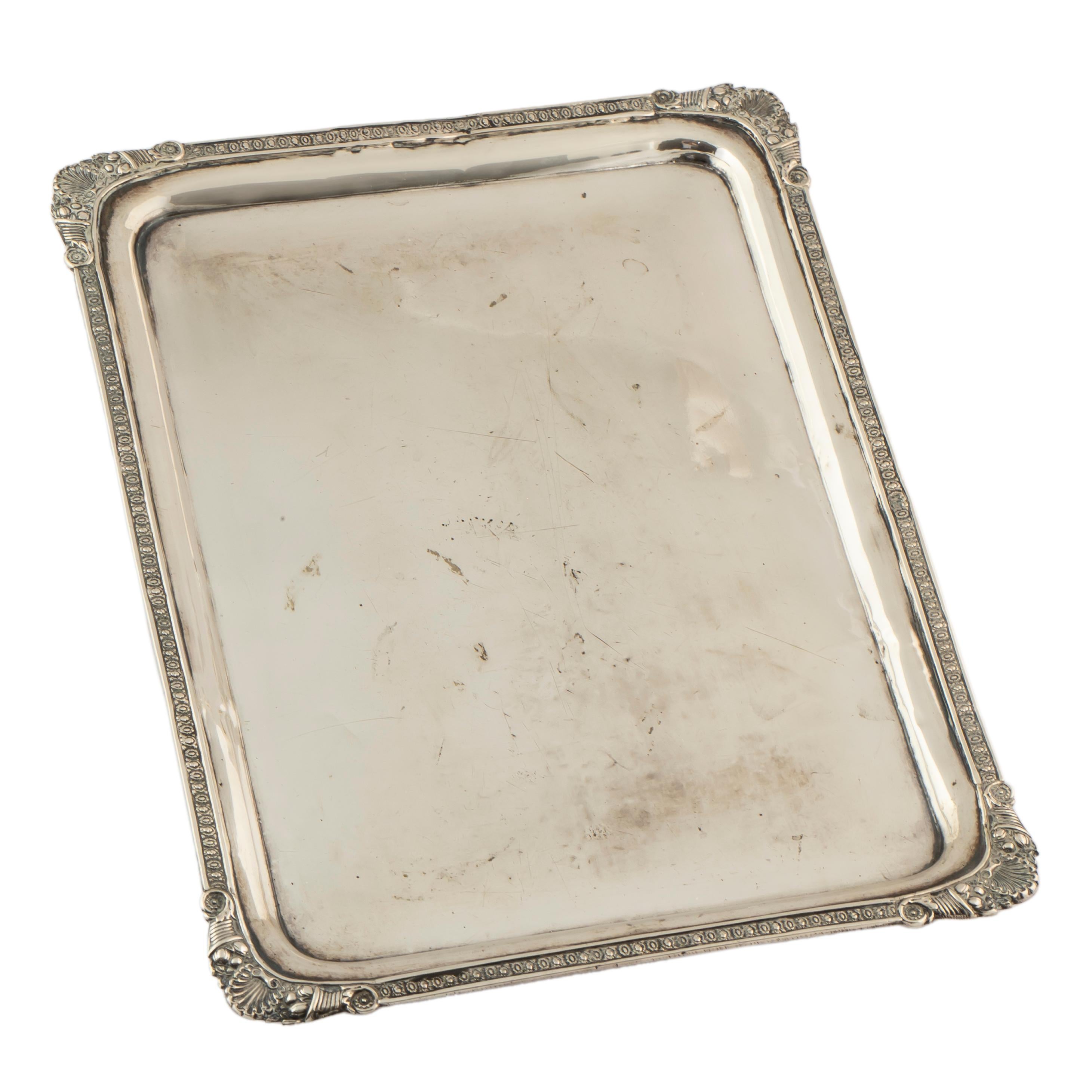 This charming Russian rectangular silver tray from the Pushkin era was crafted by the renowned silver master Fedor Timofeev of Moscow during the reign of Tsar Nicholas I in 1835.  Of polished silver with everted border, the rim is decorated with a
