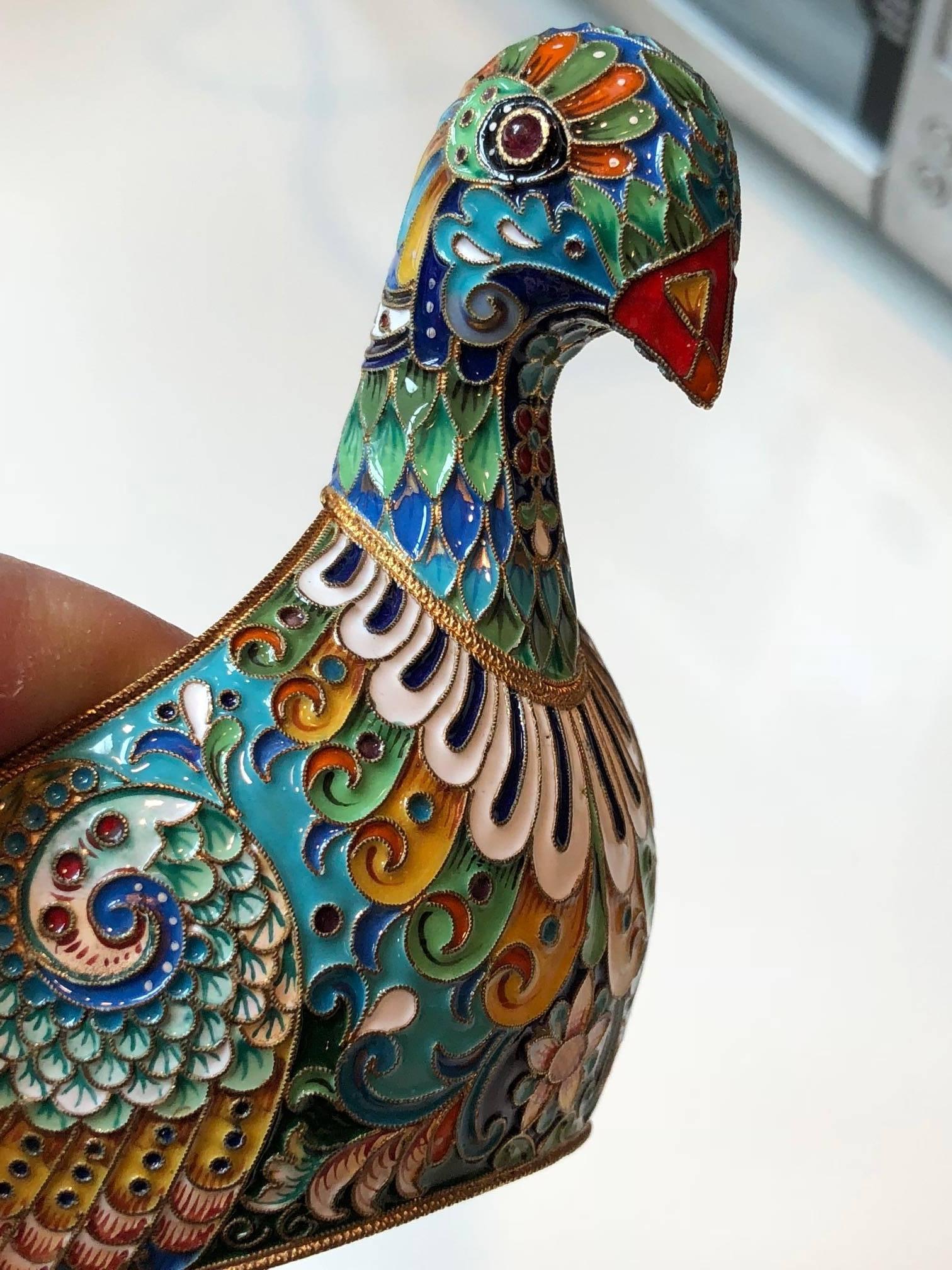 A Russian silver, jeweled and enamel Kovsch, modeled as a cloisonné bird. 
7ins long.