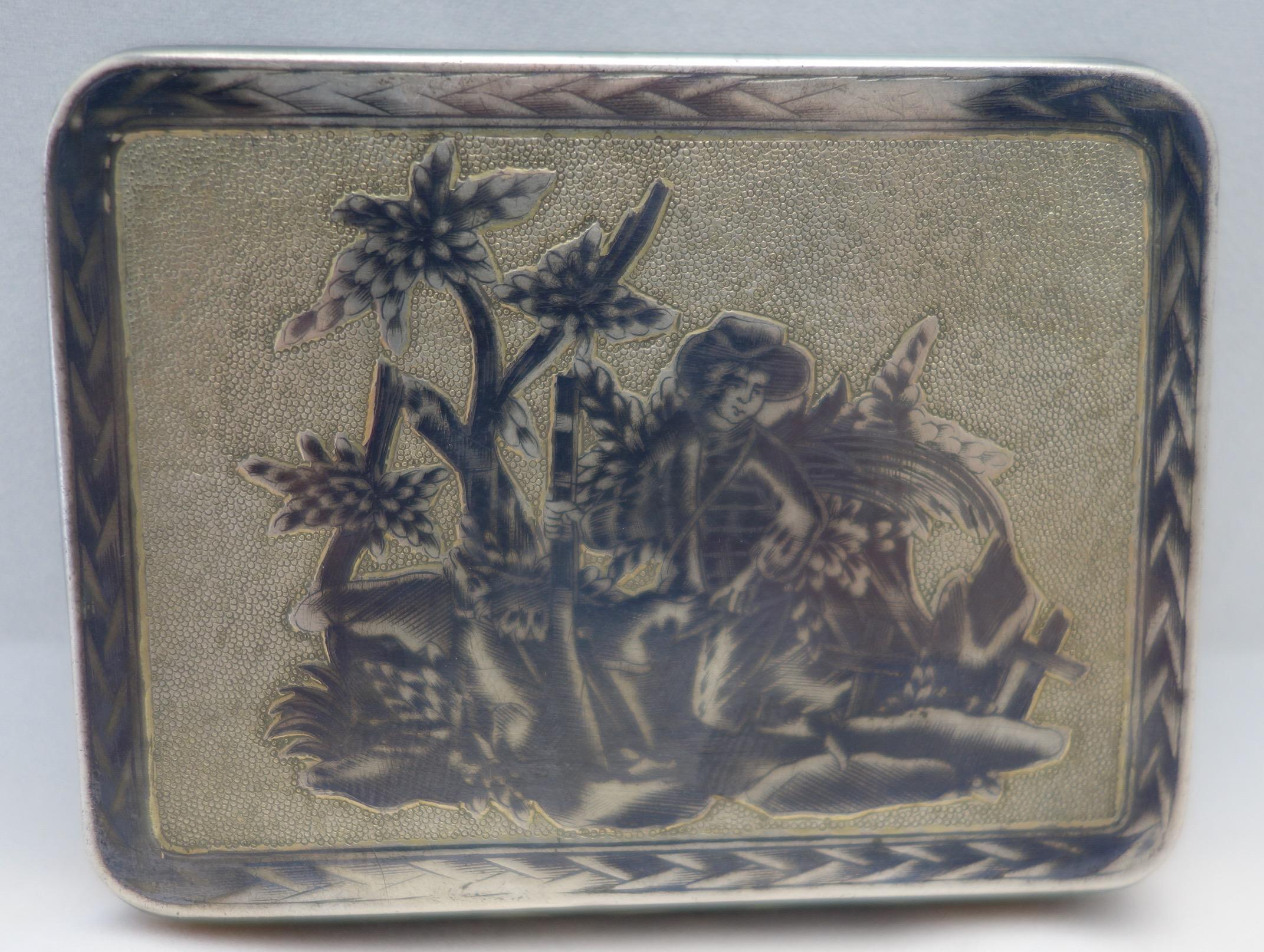 Russian silver niello tobacco box with finely etched pastoral scenes and interior gold wash. The box is marked on inside with 