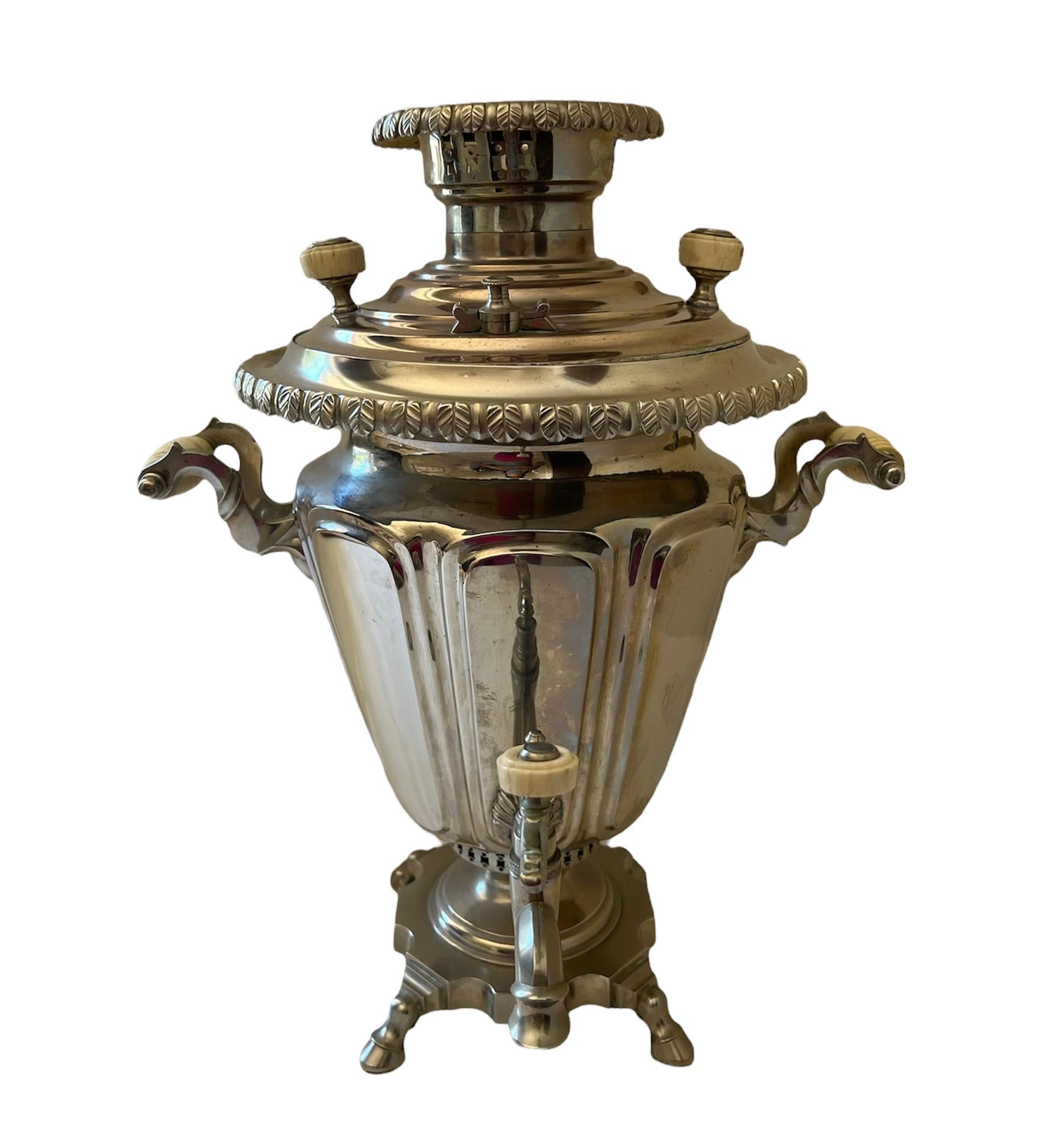 - The set is made out of silver plate with celluloid/ bone details
- The samovar features floral & geometric motifs
- The tray stamped with makers marks that are a little worn off (Зиминъ, Москва, И. Аленчинковъ, Е. Любимовой, 1681 or