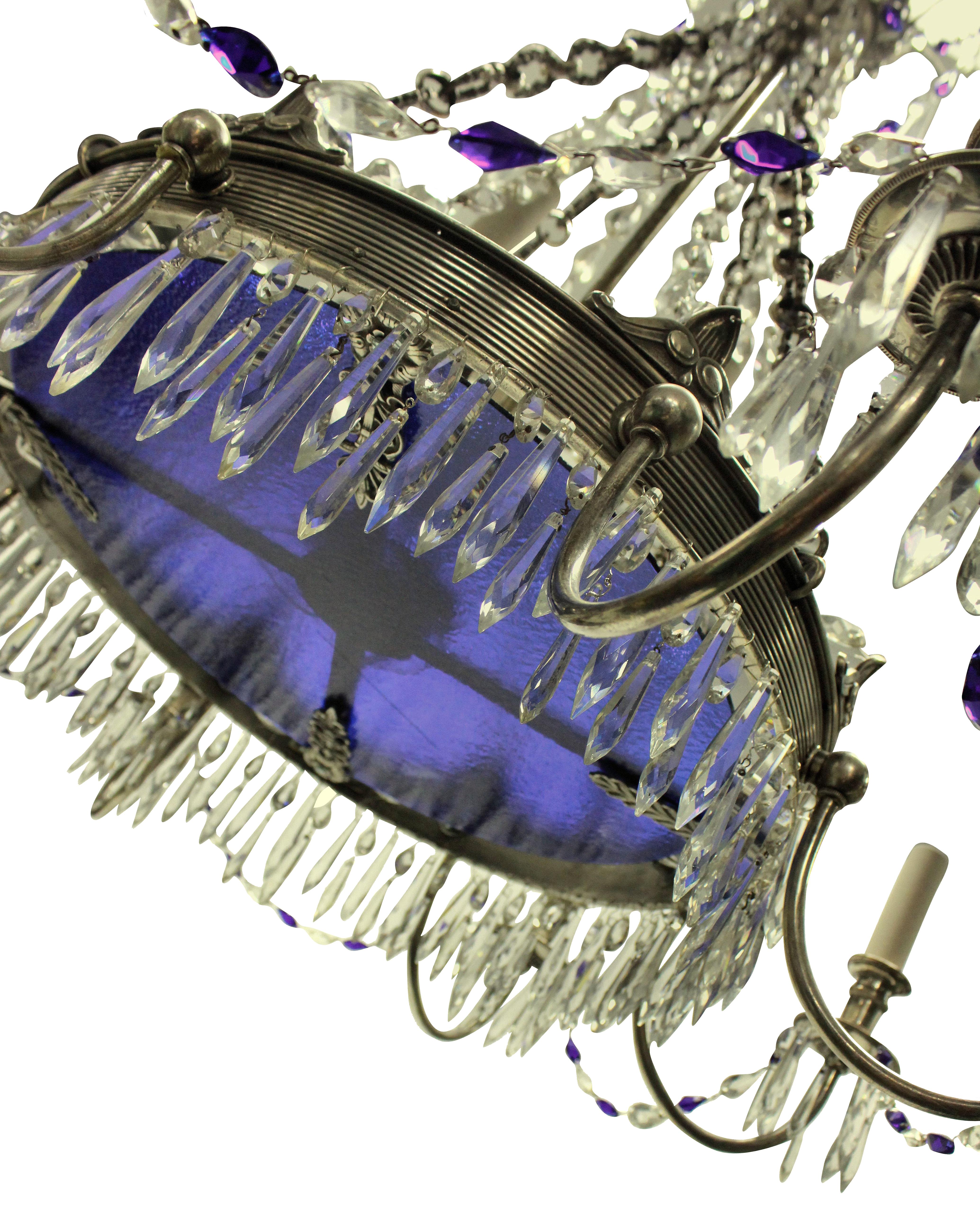 A Russian chandelier in silver plate with 'Baltic' blue cut glass drops and a central plate.